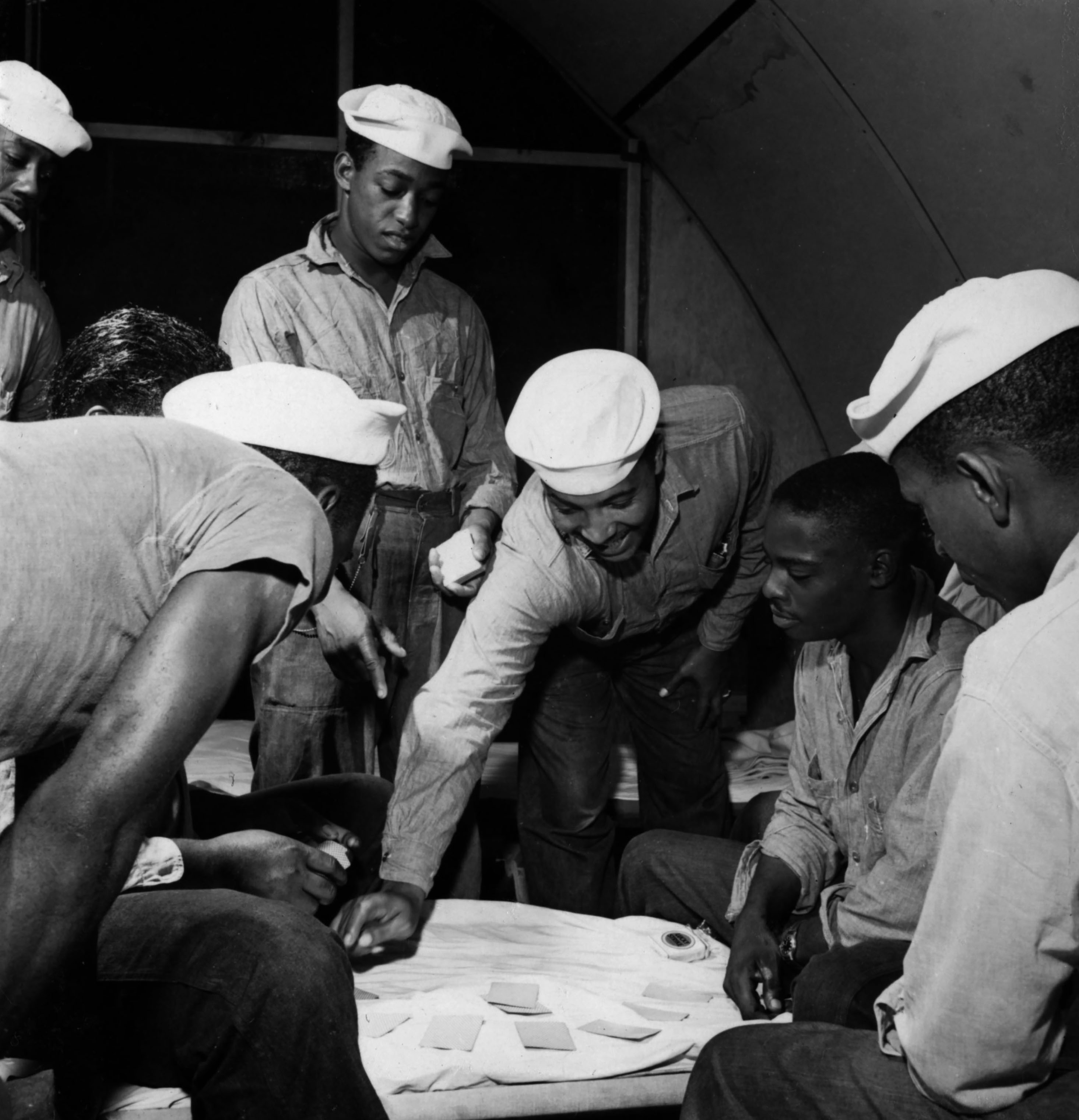 Sailors playing cards at the U.S. Naval Supply Depot on Guam. (Wayne Miller—Magnum Photos)