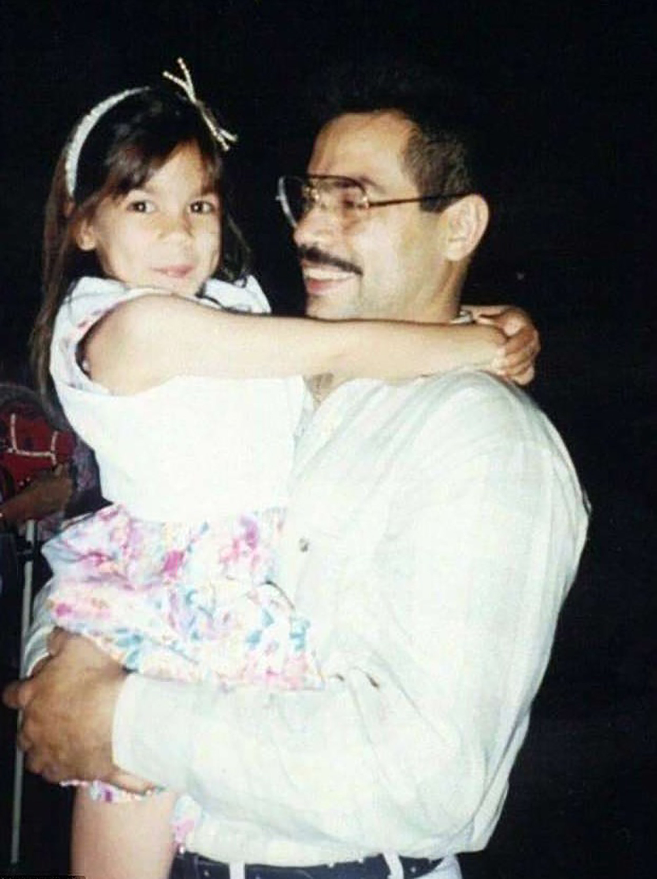 Her gregarious dad was her introduction to community organizing, she recalls. He died when she was in college. (Courtesy Ocasio-Cortez)