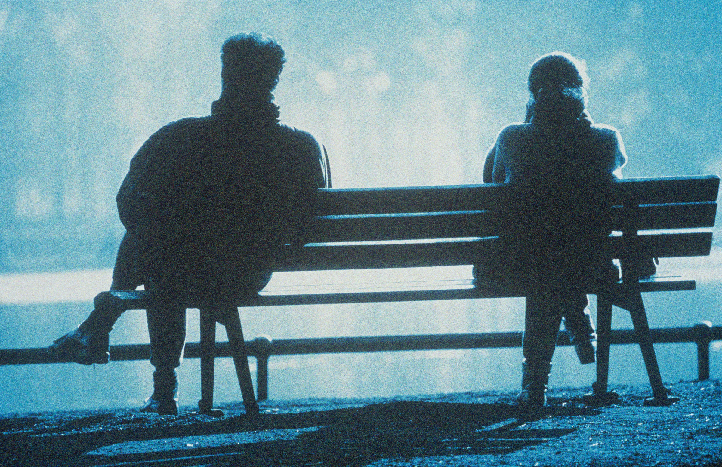 Man and woman sitting on bench