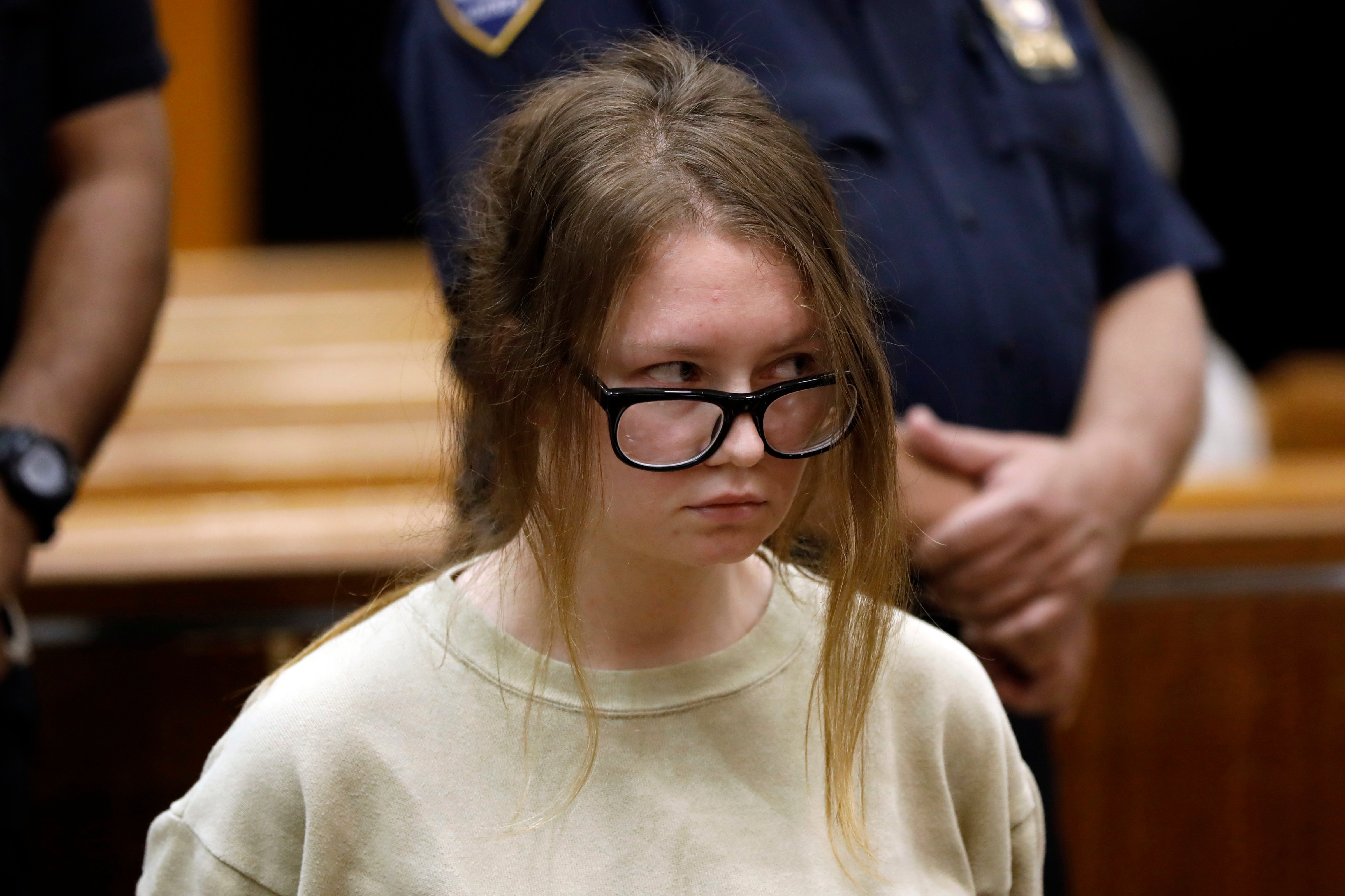 Anna Sorokin appears in New York State Supreme Court on grand larceny charges on Oct. 30, 2018. On March 27, 2019, Sorokin, the onetime darling of the Big Apple social scene known as Anna Delvey, is scheduled to stand trial on grand larceny and theft of services charges alleging she swindled $275,000 in a 10-month odyssey that saw her jetting to Omaha and Marrakesh. (Richard Drew—AP)