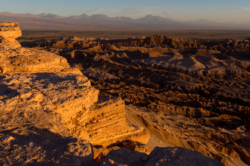 View at sunset from the overlook of the rock formation in the Valley of the Moon near San Pedro de Atacama in the Atacama Desert in northern Chile. (Wolfgang Kaehler—LightRocket/Getty Images)