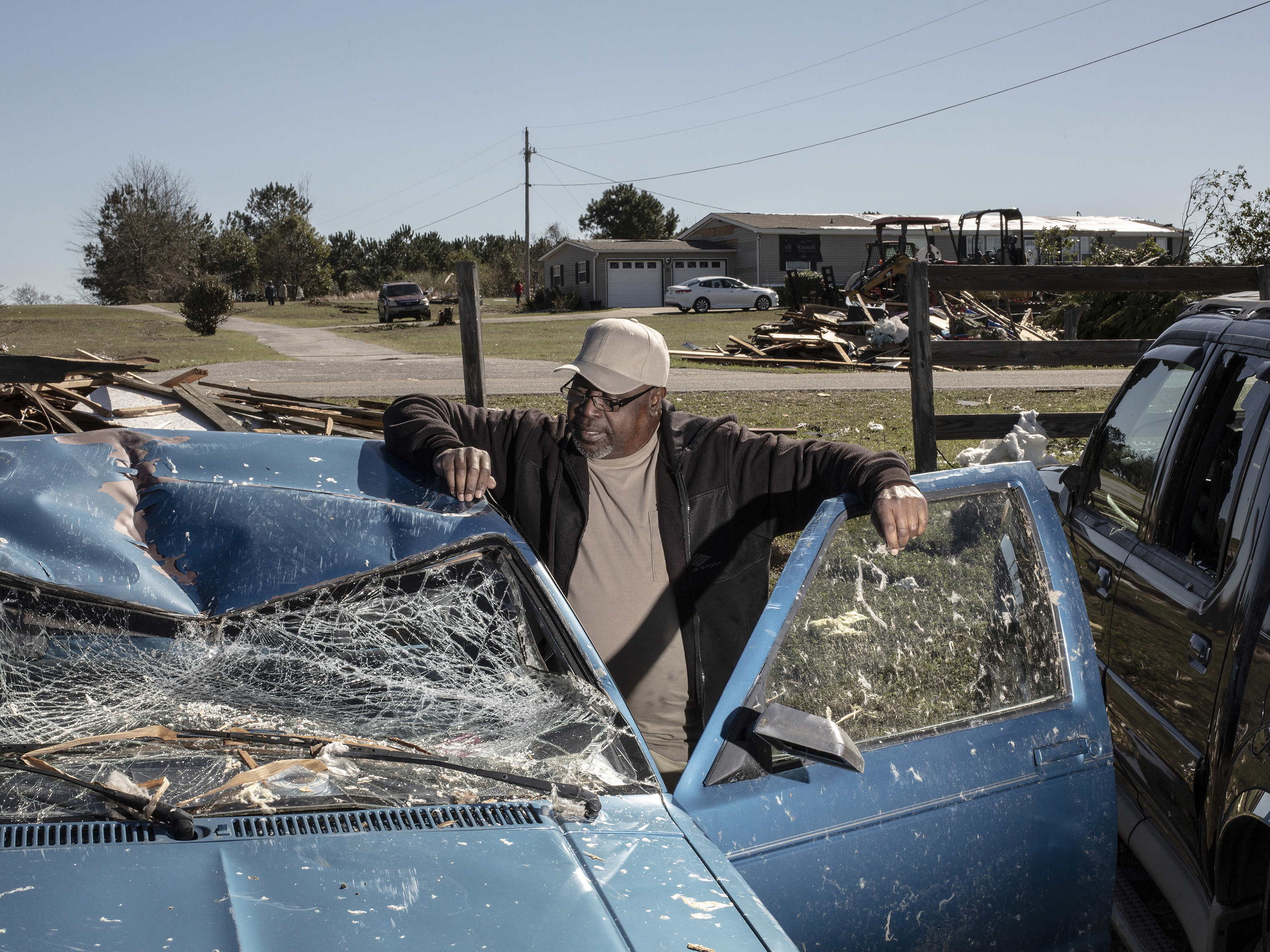 Jimmie Tables poses for a portrait with his truck that was destroyed after a tornado passed over killing several people and destroying homes in Beauregard, Alabama on March 4, 2019. (Bryan Anselm—Redux for TIME)