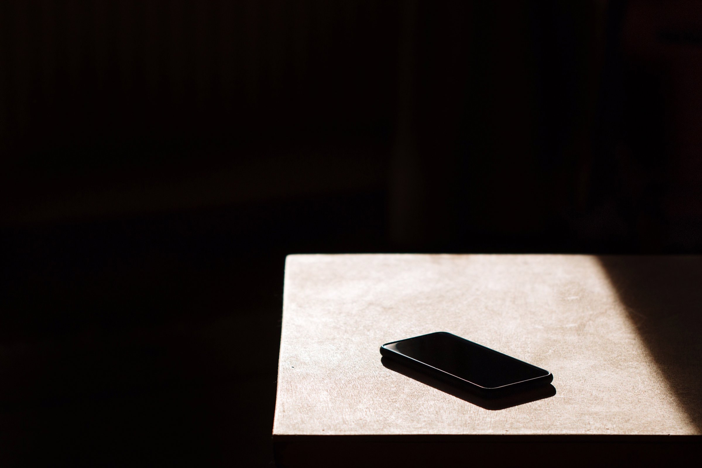 A cellphone on a table to represent people in Chad living without social media for a year