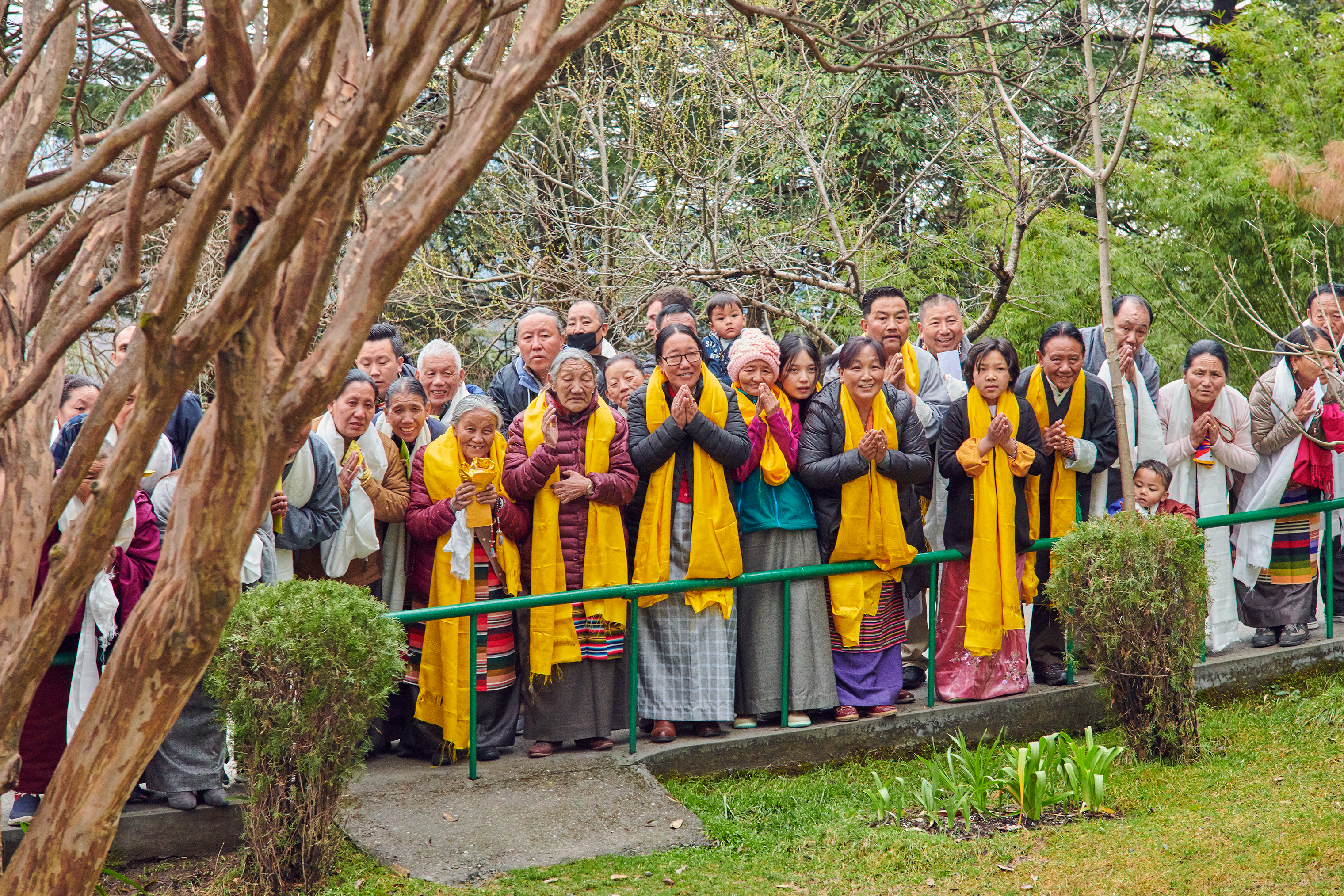 Around 300 devotees line up early at Tsuglagkhang temple to offer the Dalai Lama traditional khata scarves and to receive his blessing. (Ruven Afanador for TIME)