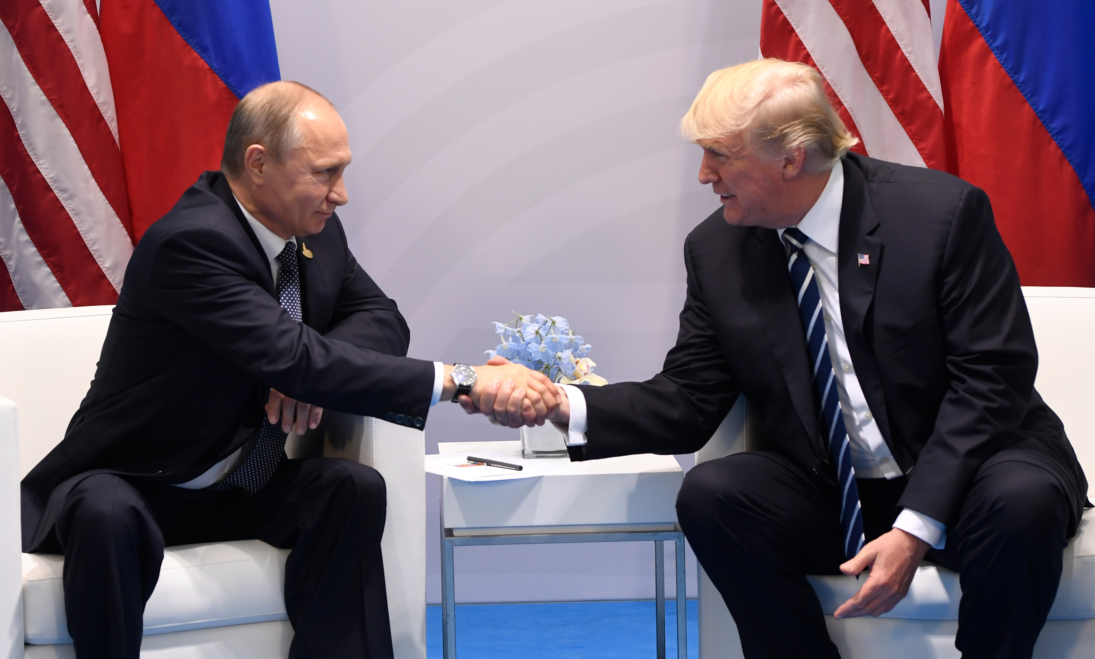 President Donald Trump and Russia's President Vladimir Putin shake hands during a meeting on the sidelines of the G20 Summit in Hamburg, Germany, on July 7, 2017. (SAUL LOEB—AFP/Getty Images)
