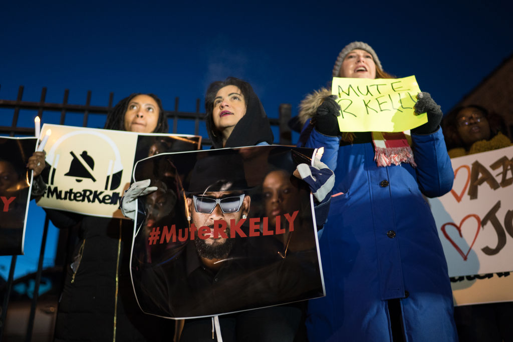 Protestors gather near R. Kelly's former recording studio in Chicago on Jan. 9, 2019 following the release of a Lifetime docuseries 'Surviving R. Kelly' which highlighted years of sexual abuse against young women. (Max Herman—NurPhoto/Getty Images)