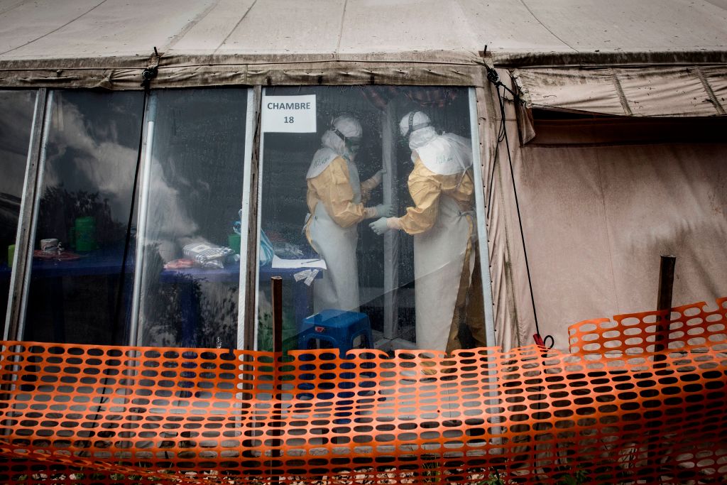 Health workers are seen inside an Ebola treatment centre in Butembo, Democratic Republic of Congo, on March 9, 2019. (John Wessels—AFP/Getty Images)