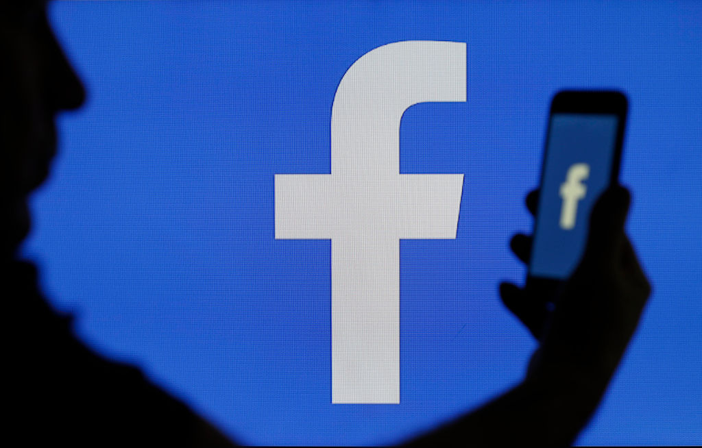 The Facebook logo is seen on a Facebook is displayed on the screen of a computer on March 15, 2019 in Paris, France. (Chesnot—Getty Images)