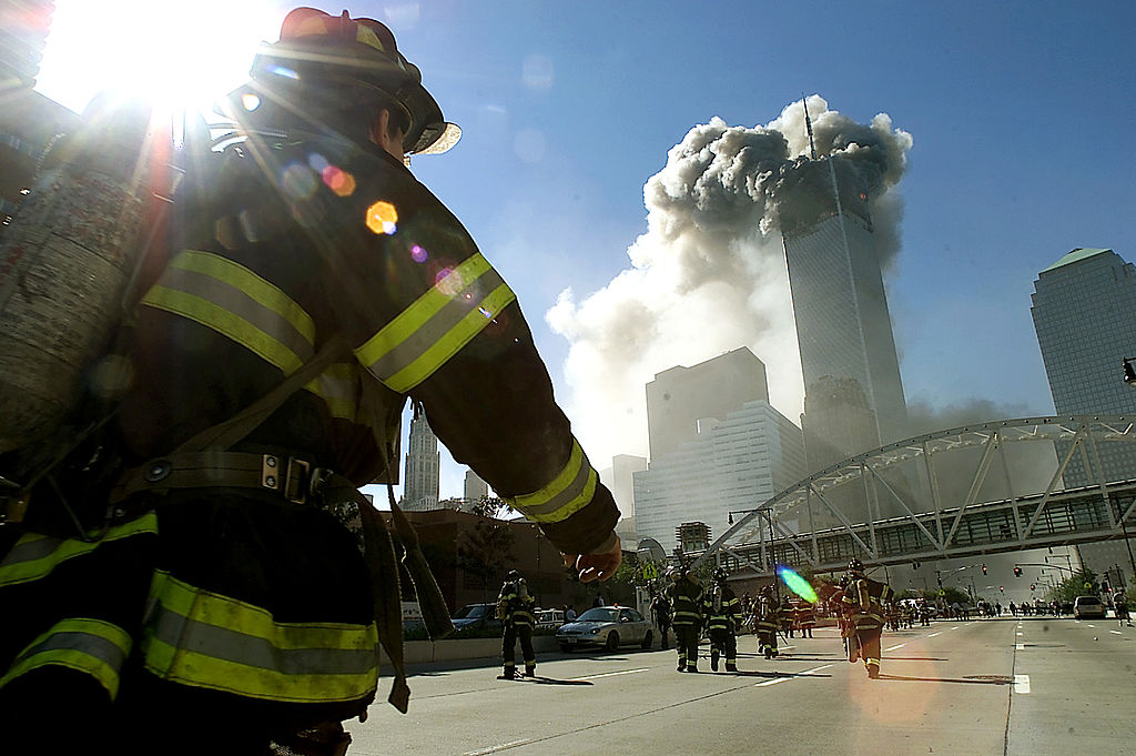Firefighters walk towards one of the World Trade Center towers before it collapsed after a plane hit the building Sept. 11, 2001 in New York City. (Jose Jimenez/Primera Hora—Getty Images NA)