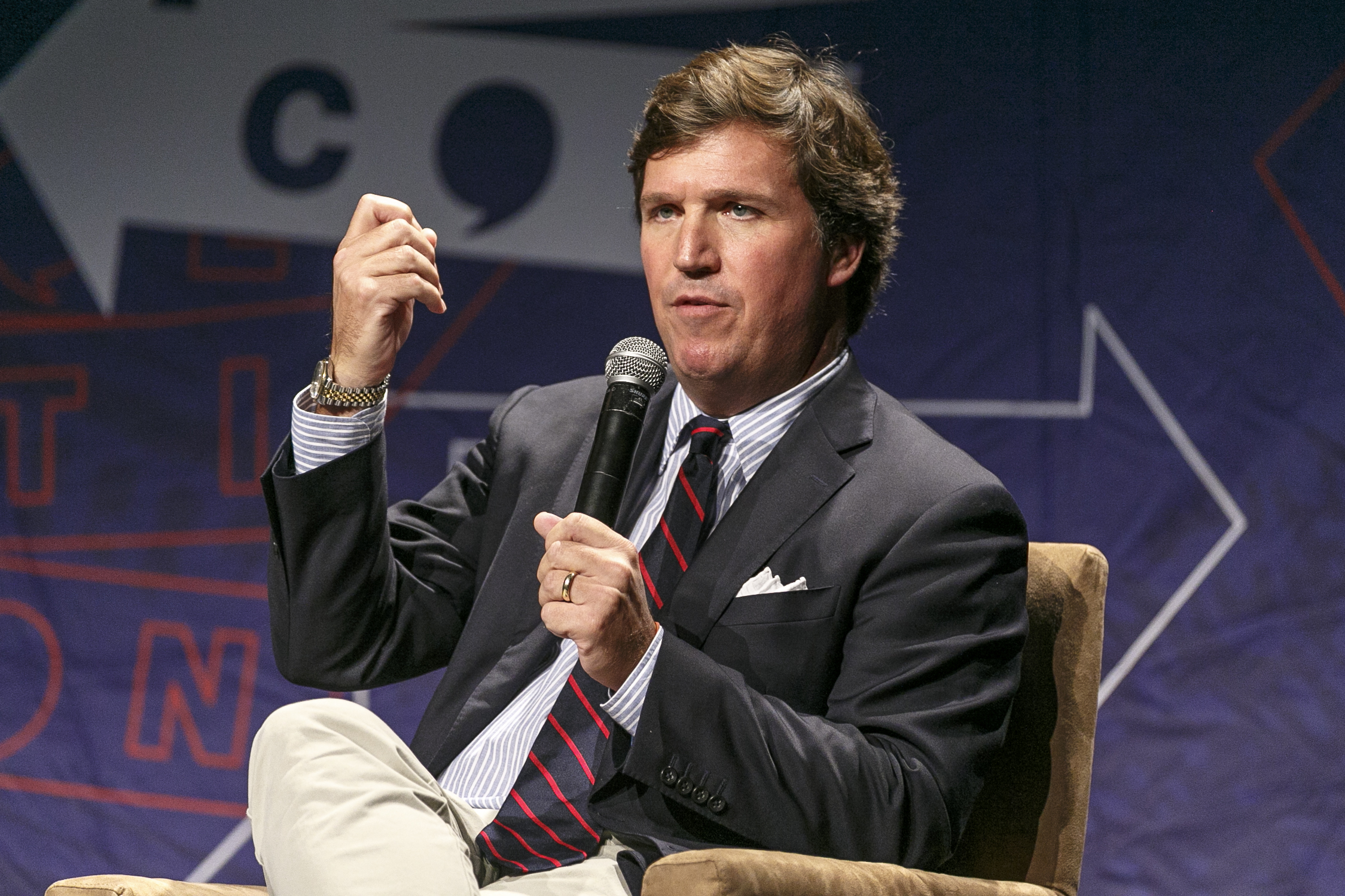 Tucker Carlson speaks onstage during Politicon 2018 at Los Angeles Convention Center on Oct. 21, 2018. (Rich Polk—Politicon/Getty Images)
