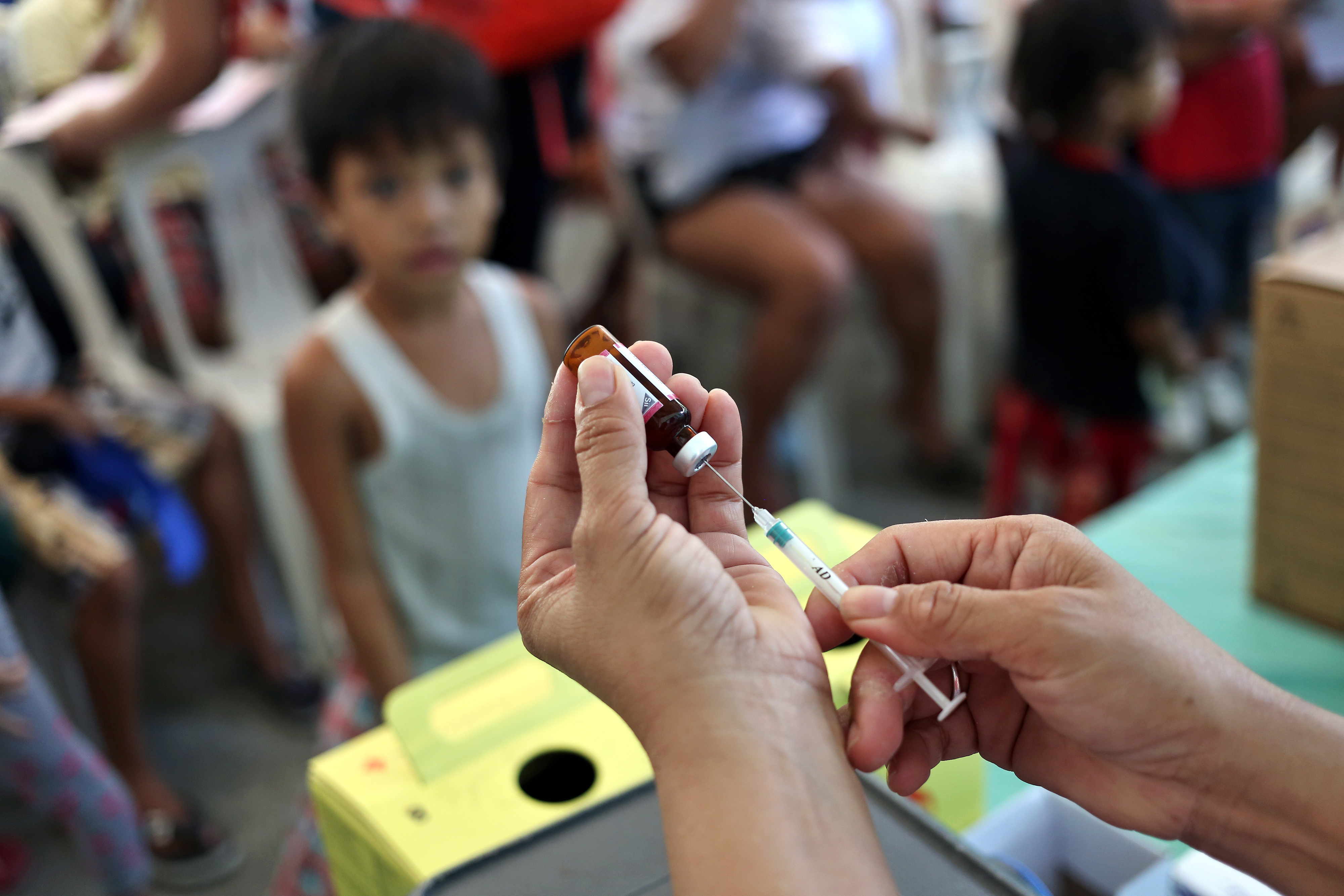 Red Cross staff work on a measles vaccination campaign in Manila, Philippines on Feb. 16, 2019 (Alejandro Ernesto—Picture Alliance/Getty Images)