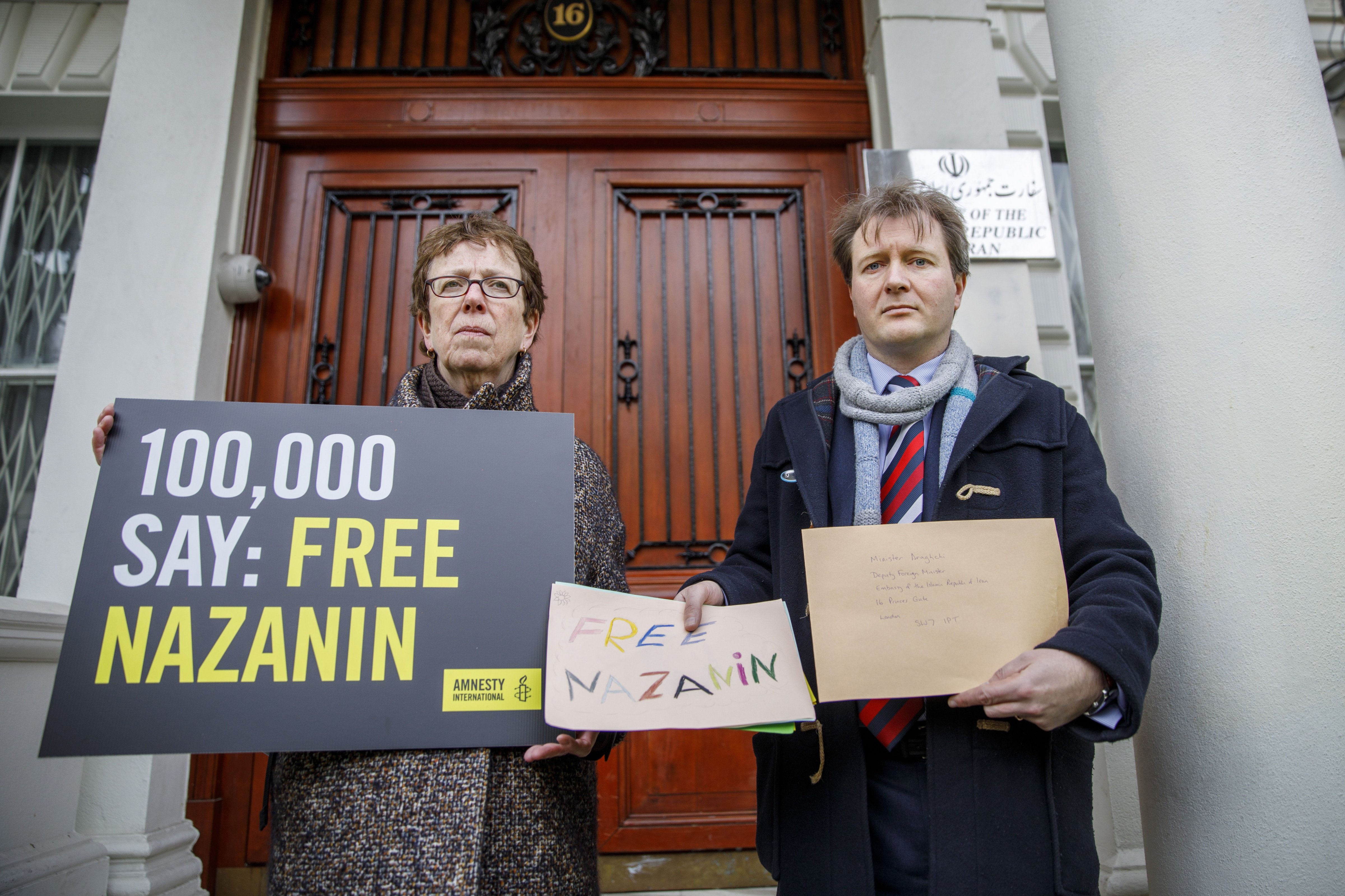 Richard Ratcliffe, (R), husband of jailed British-Iranian woman Nazanin Zaghari-Ratcliffe, delivers a petition and a letter to demand her release, at the Iranian Embassy in London on Feb. 21, 2018. (TOLGA AKMEN&mdash;AFP/Getty Images)