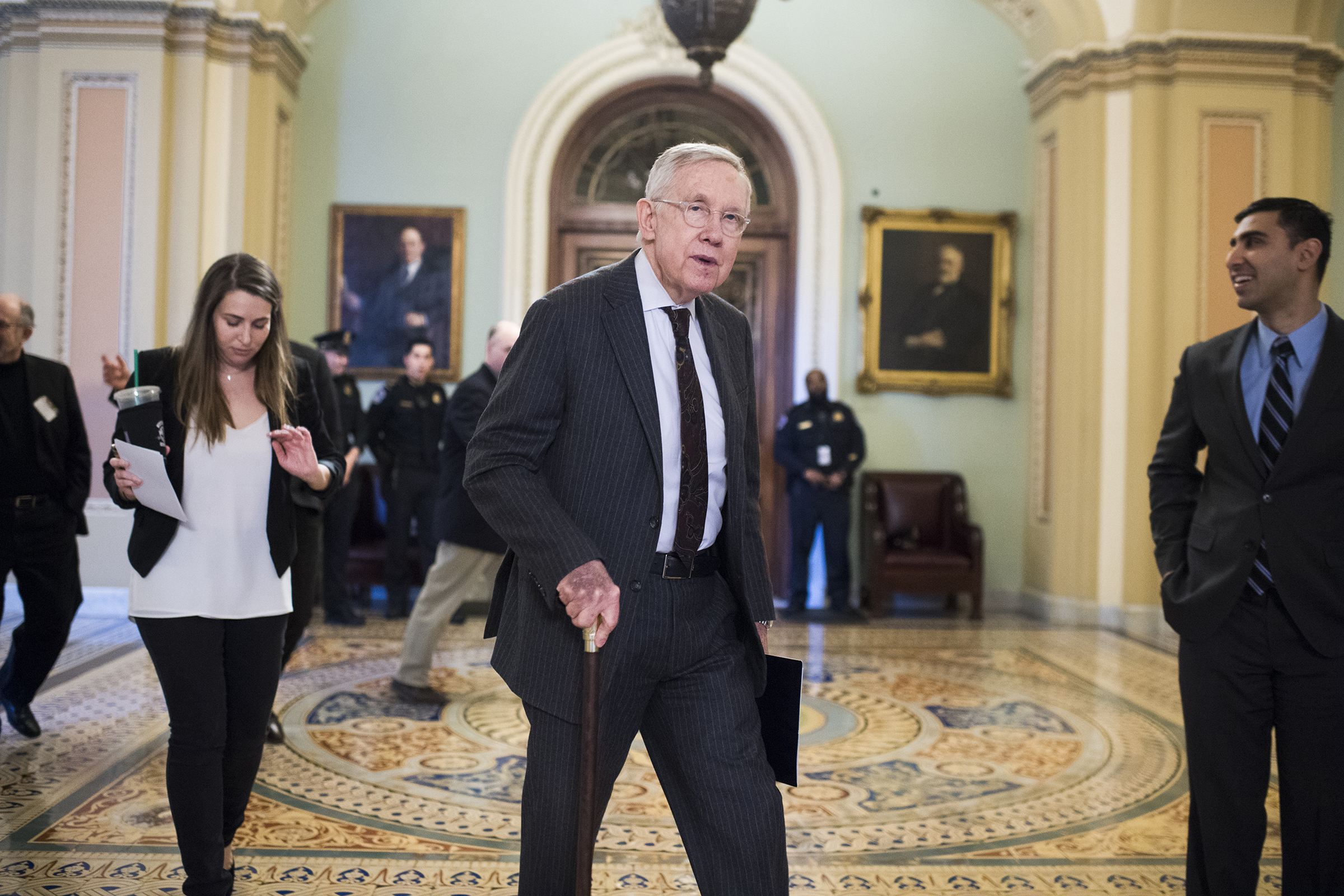 Senate Minority Leader Harry Reid makes his way to an easement signing ceremony in the Capitol to help protect Nevada's Basin and Range National Monument that contains artist Michael Heizer's modern art sculpture "City," Dec. 15, 2016. (Tom Williams—CQ-Roll Call/Getty Images)