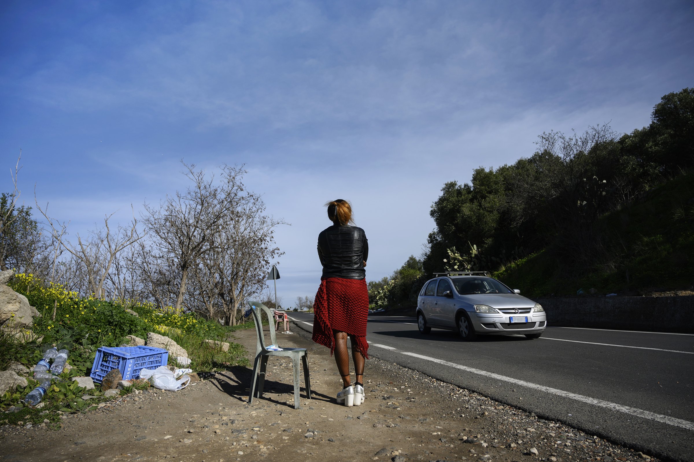 Blessing, 29, a Nigerian woman trafficked into sex work, waits for customers in Sicily, Italy