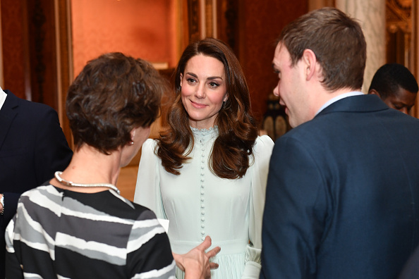 Catherine, Duchess of Cambridge speaks to guests as she attends a reception to mark the fiftieth anniversary of the investiture of the Prince of Wales at Buckingham Palace in London on March 5, 2019. (Dominic Lipinski—WPA Pool/Getty Images)