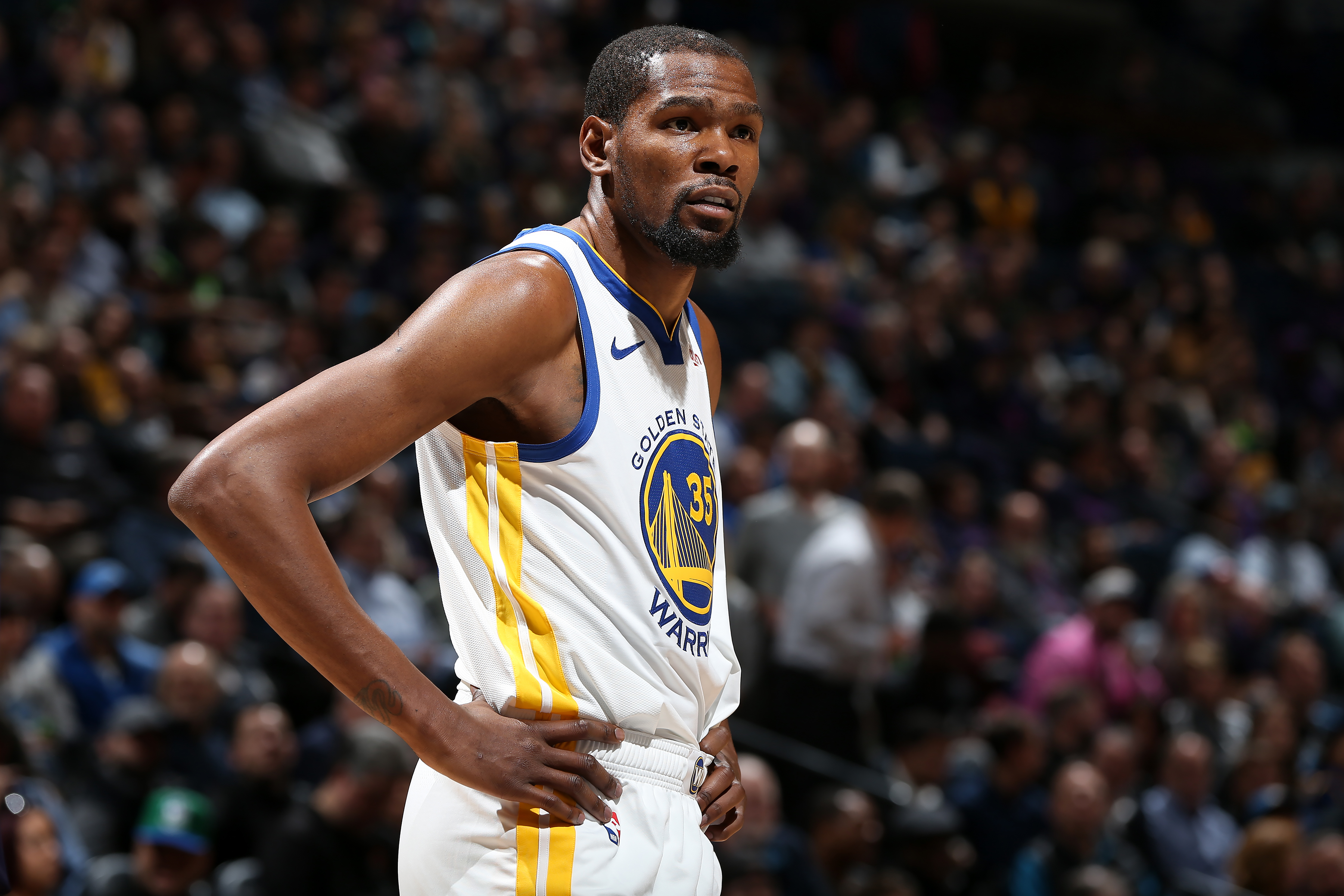 MINNEAPOLIS, MN - MARCH 19: Kevin Durant #35 of the Golden State Warriors looks on against the Minnesota Timberwolves on March 19, 2019 at Target Center in Minneapolis, Minnesota. NOTE TO USER: User expressly acknowledges and agrees that, by downloading and or using this Photograph, user is consenting to the terms and conditions of the Getty Images License Agreement. Mandatory Copyright Notice: Copyright 2019 NBAE (Photo by David Sherman/NBAE via Getty Images) (David Sherman—NBAE/Getty Images)
