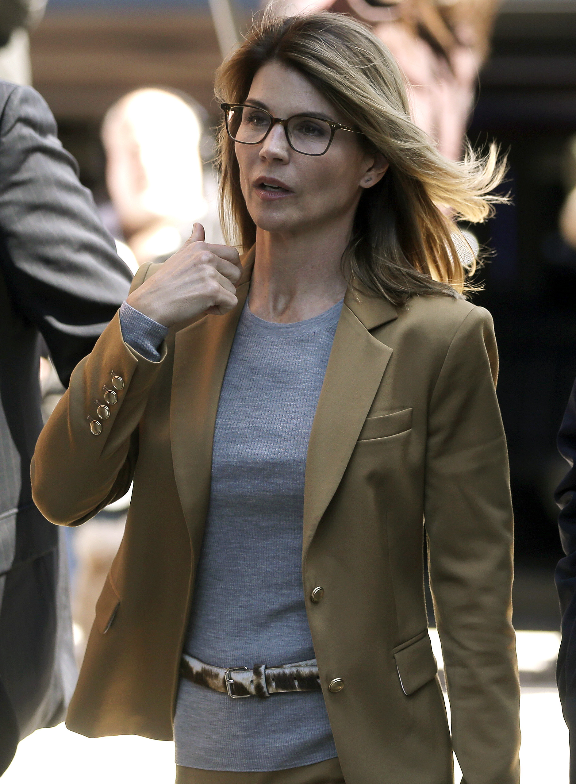 Lori Loughlin arrives at federal court in Boston on Wednesday, April 3, 2019, to face charges in a nationwide college admissions bribery scandal. (Steven Senne—AP)