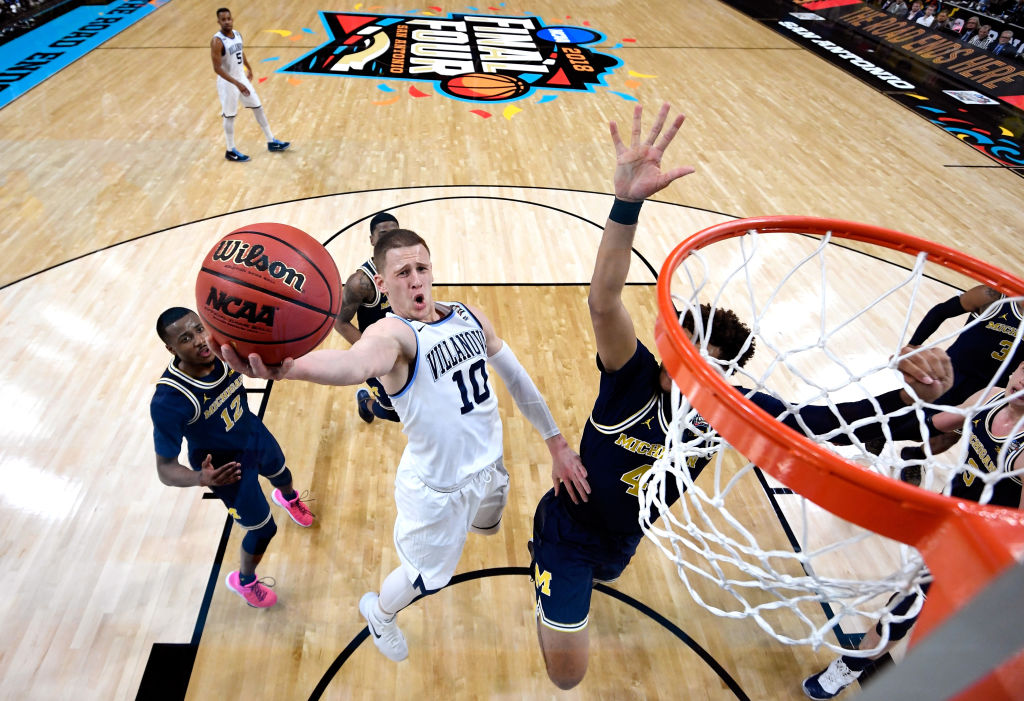 Donte DiVincenzo #10 of the Villanova Wildcats drives to the basket against Isaiah Livers #4 of the Michigan Wolverines in the first half during the 2018 NCAA Men's Final Four National Championship game at the Alamodome on April 2, 2018 in San Antonio, Texas. (Pool&mdash;Getty Images)