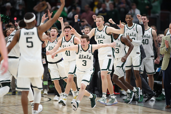 Michigan State Spartans guard Foster Loyer #3 and Michigan State Spartans players celebrate after defeating the Michigan Wolverines in a Big Ten Tournament Championship game between the Michigan Wolverines and the Michigan State Spartans at the United Center in Chicago, IL on March 17, 2019.