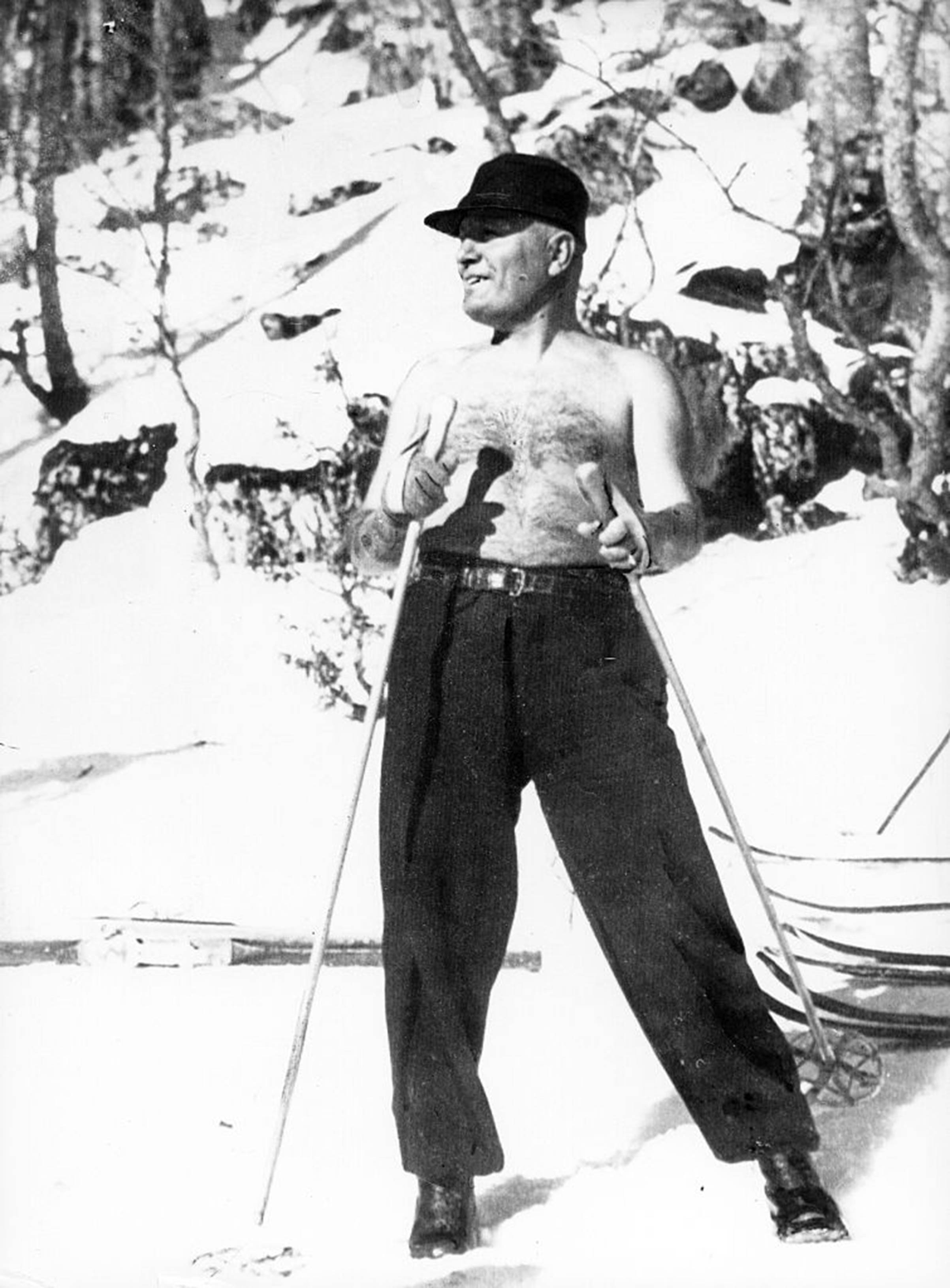 Italian fascist dictator Benito Mussolini strikes a pose while skiing in Italy with his son in 1937. (ullstein bild—Getty Images)