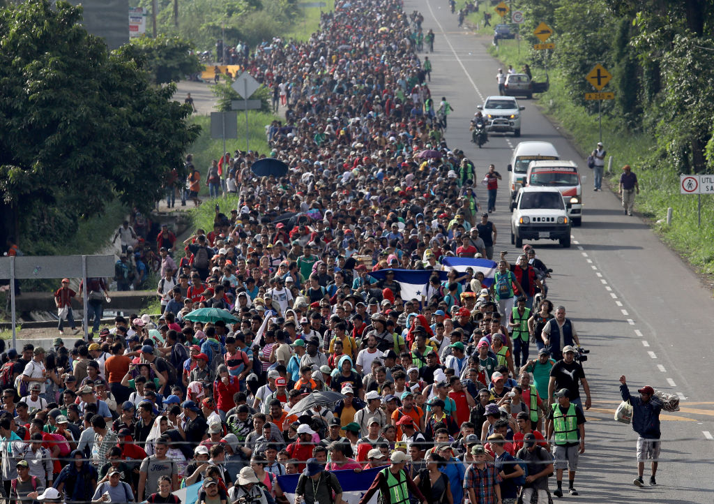 A migrant caravan walks into the interior of Mexico after crossing the Guatemalan border near Ciudad Hidalgo, Mexico on Oct. 21, 2018. (John Moore—Getty Images)