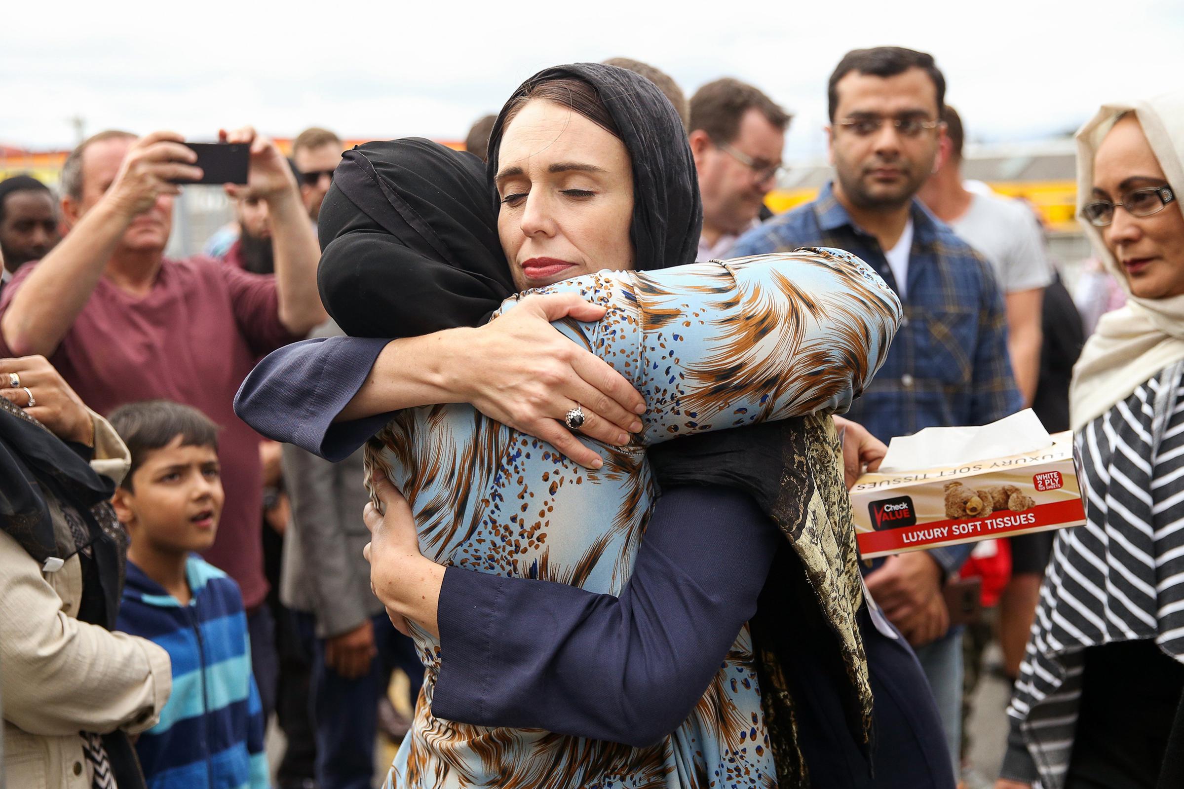 New Zealand Prime Minister Jacinda Ardern hugs a worshipper at Kilbirnie Mosque in Wellington two days after the attacks
