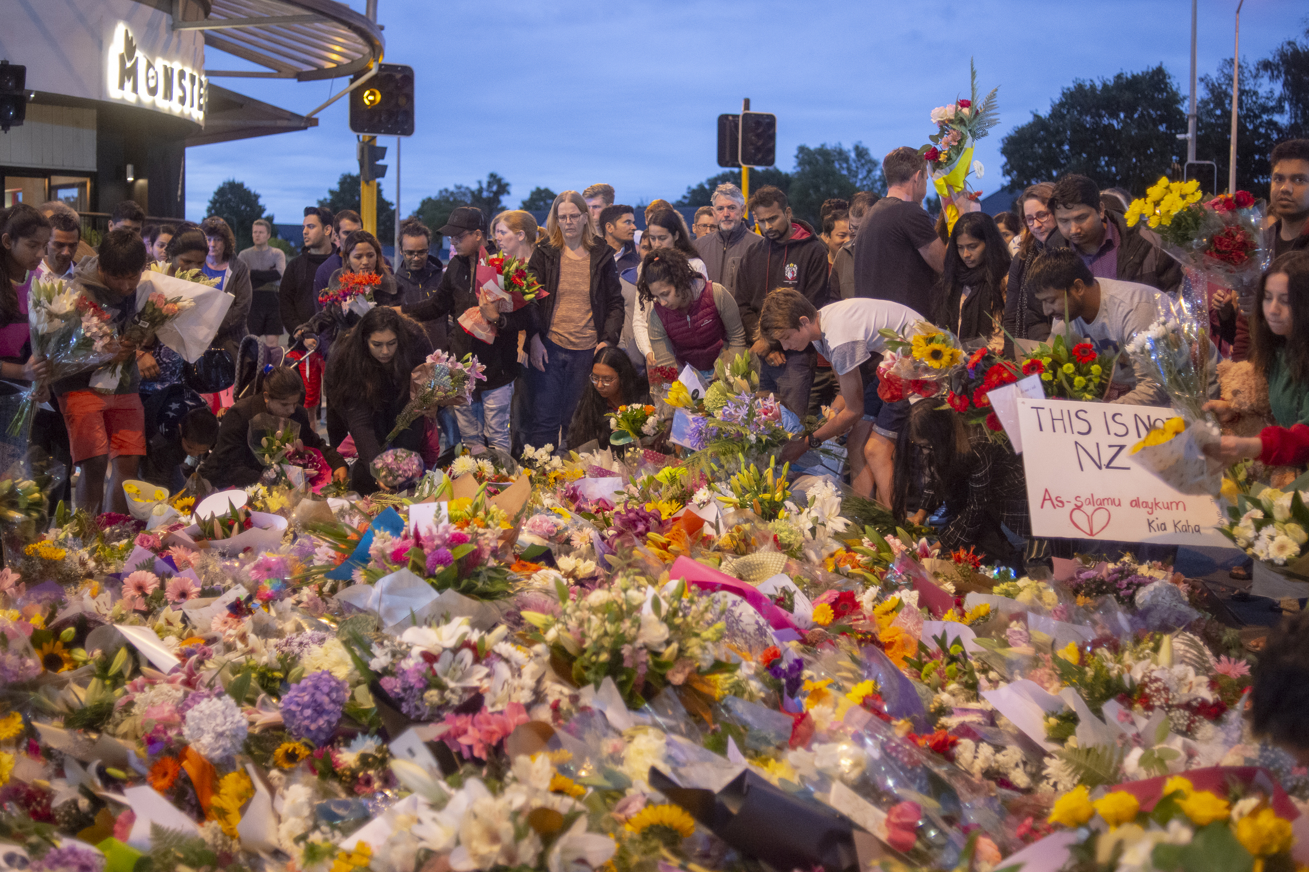 People pay their respects for victims of the March 15 mosque attacks, in Christchurch on March 16, 2019. (Virginia Woods-Jack for TIME)