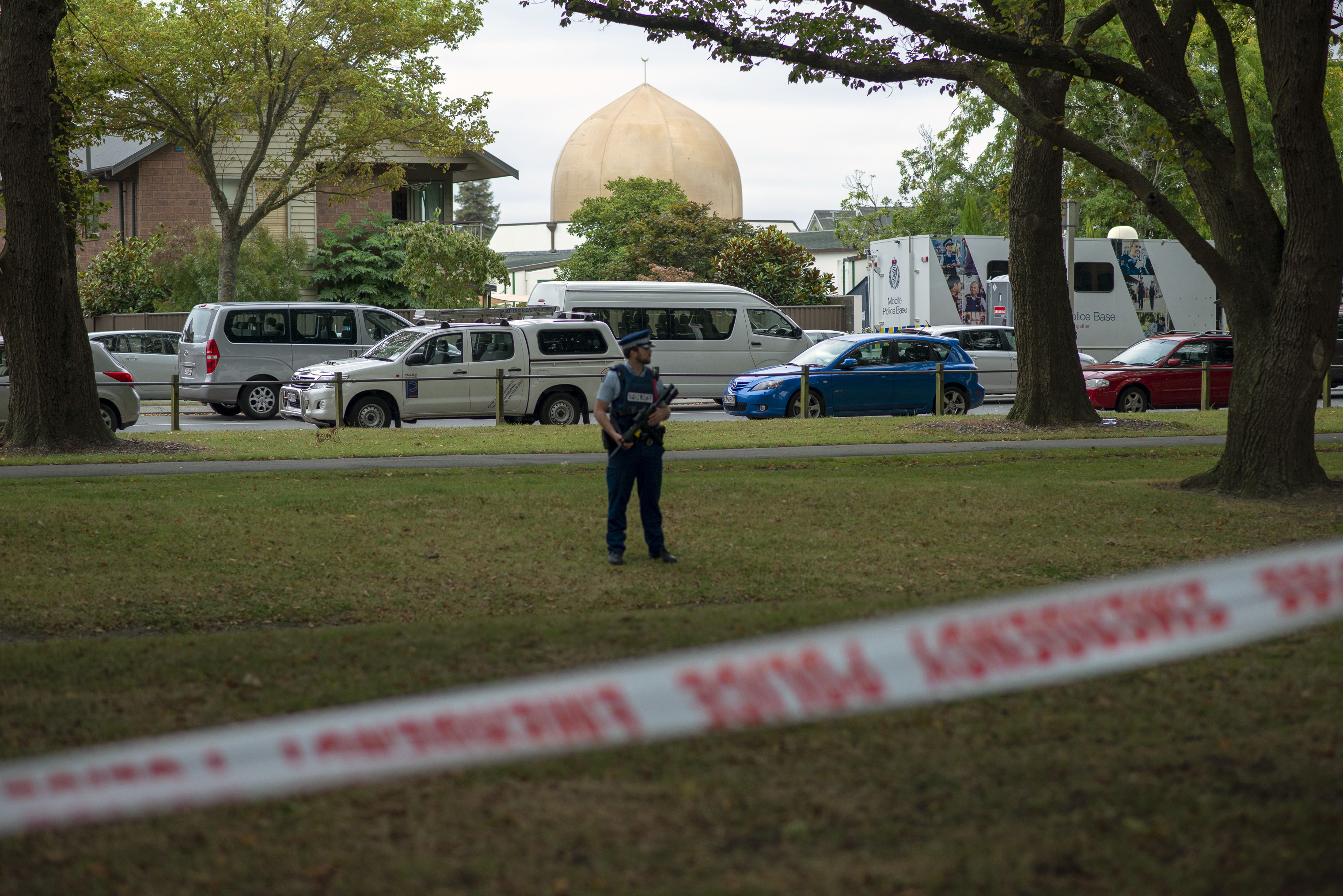 A police officer stands guard in front of the Masjid Al Noor mosque on March 18, 2019 in Christchurch, New Zealand, where one of the two mass shootings occurred on March 15, 2019. (Virginia Woods-Jack for TIME)
