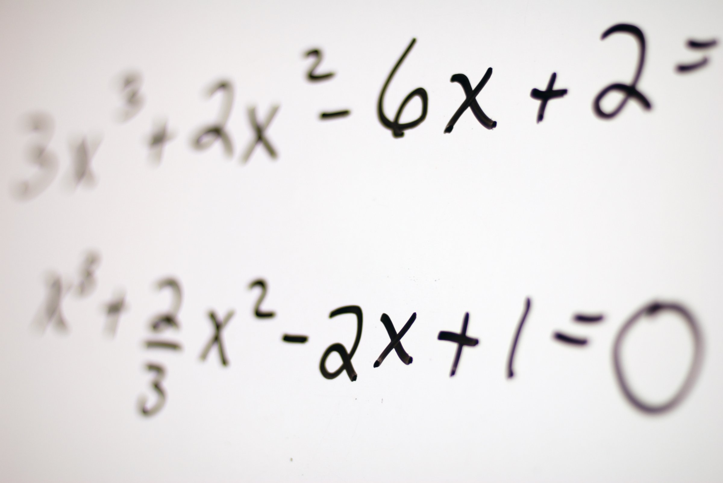 Fading to clear math equations on white board