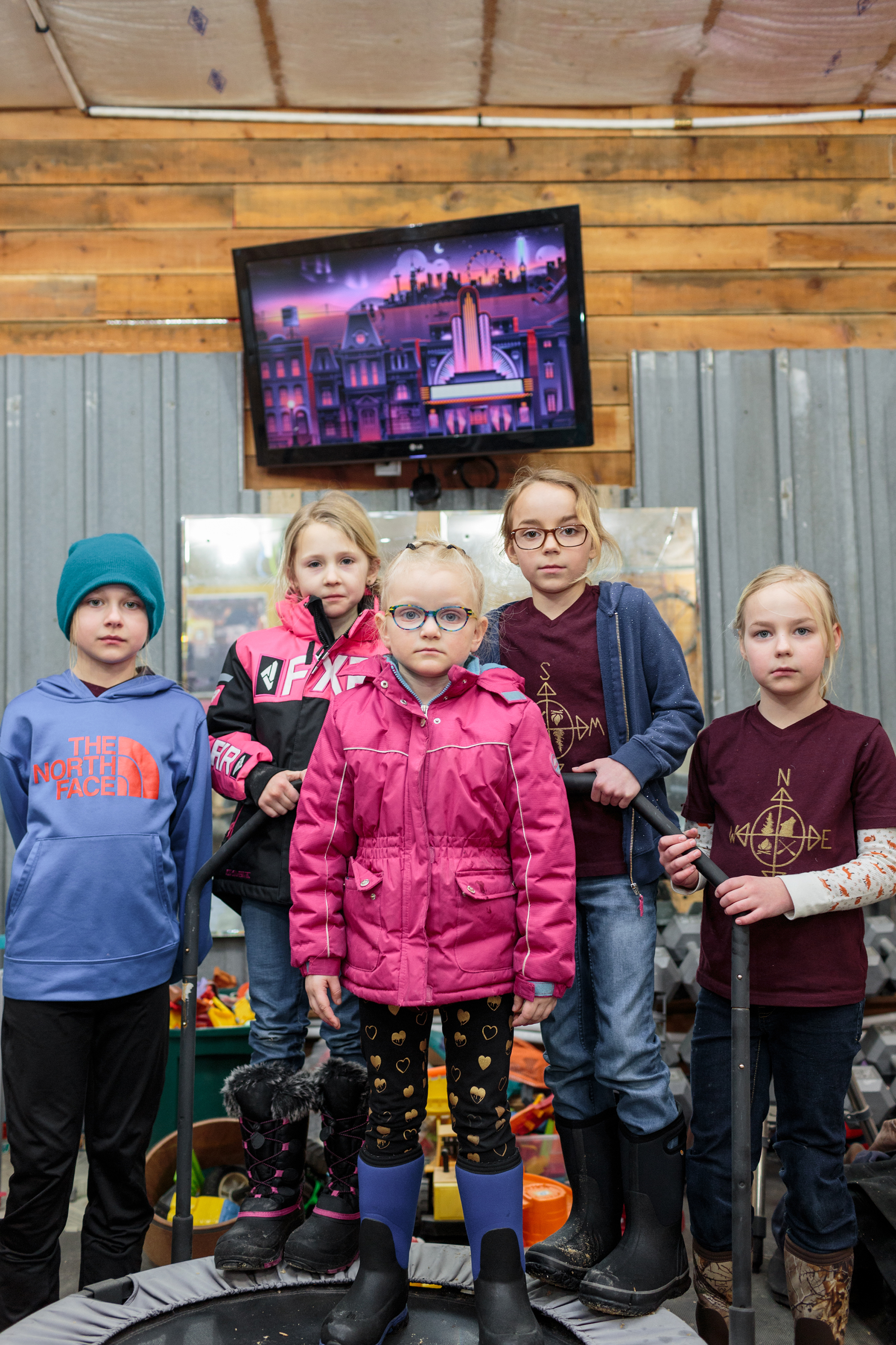 Ava McKeever, Andie McKeever, Iris Knight, Adley Goulet and Emma Goulet stand for a portrait during a weekly "Angle Ladies Adventure Society" in the workshop outside of Sara McGoon, the group leader's home. (Sarah Blesener for TIME)