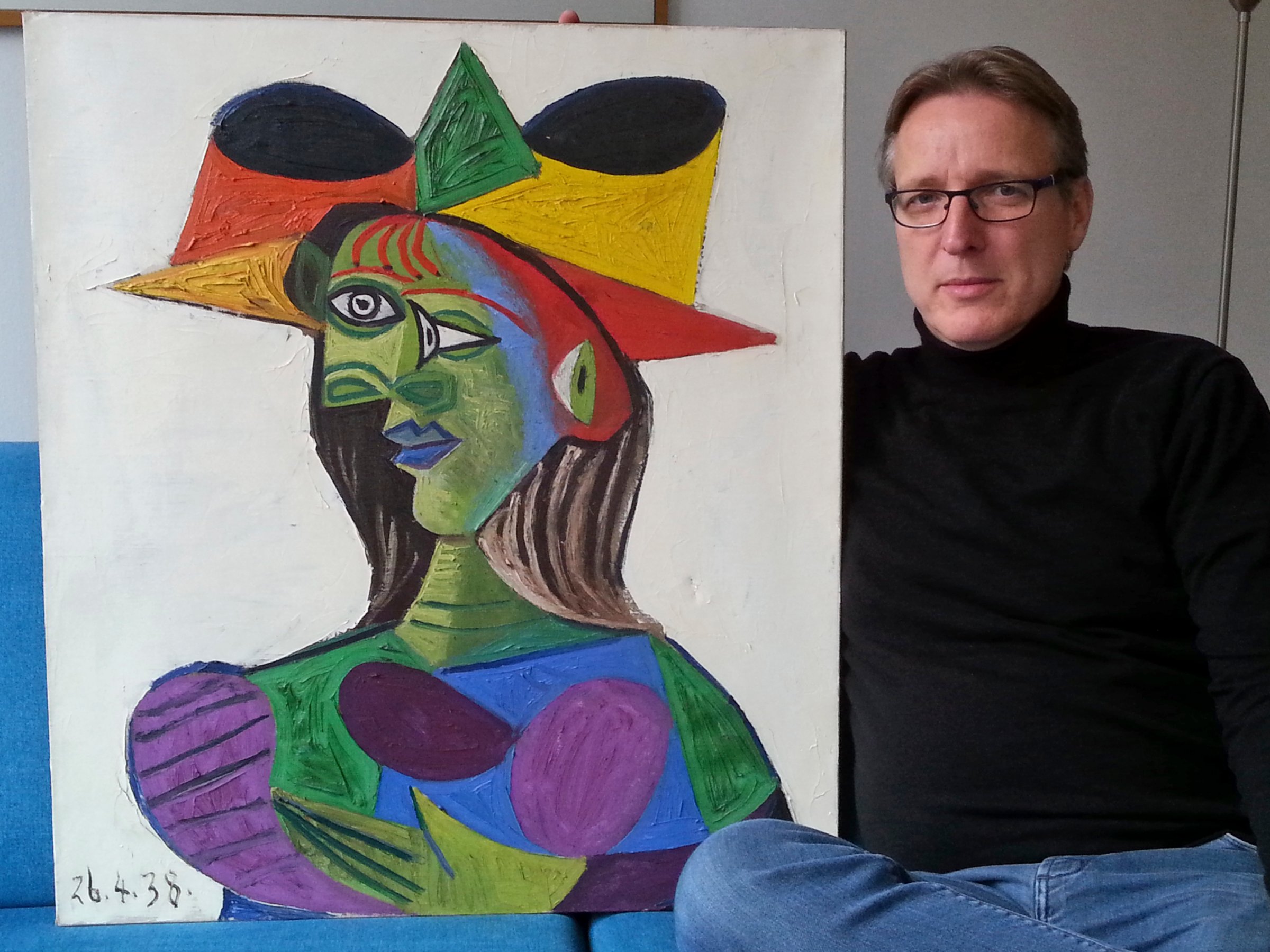 Dutch art detective Arthur Brand sits with "Buste de Femme", a recovered Picasso painting