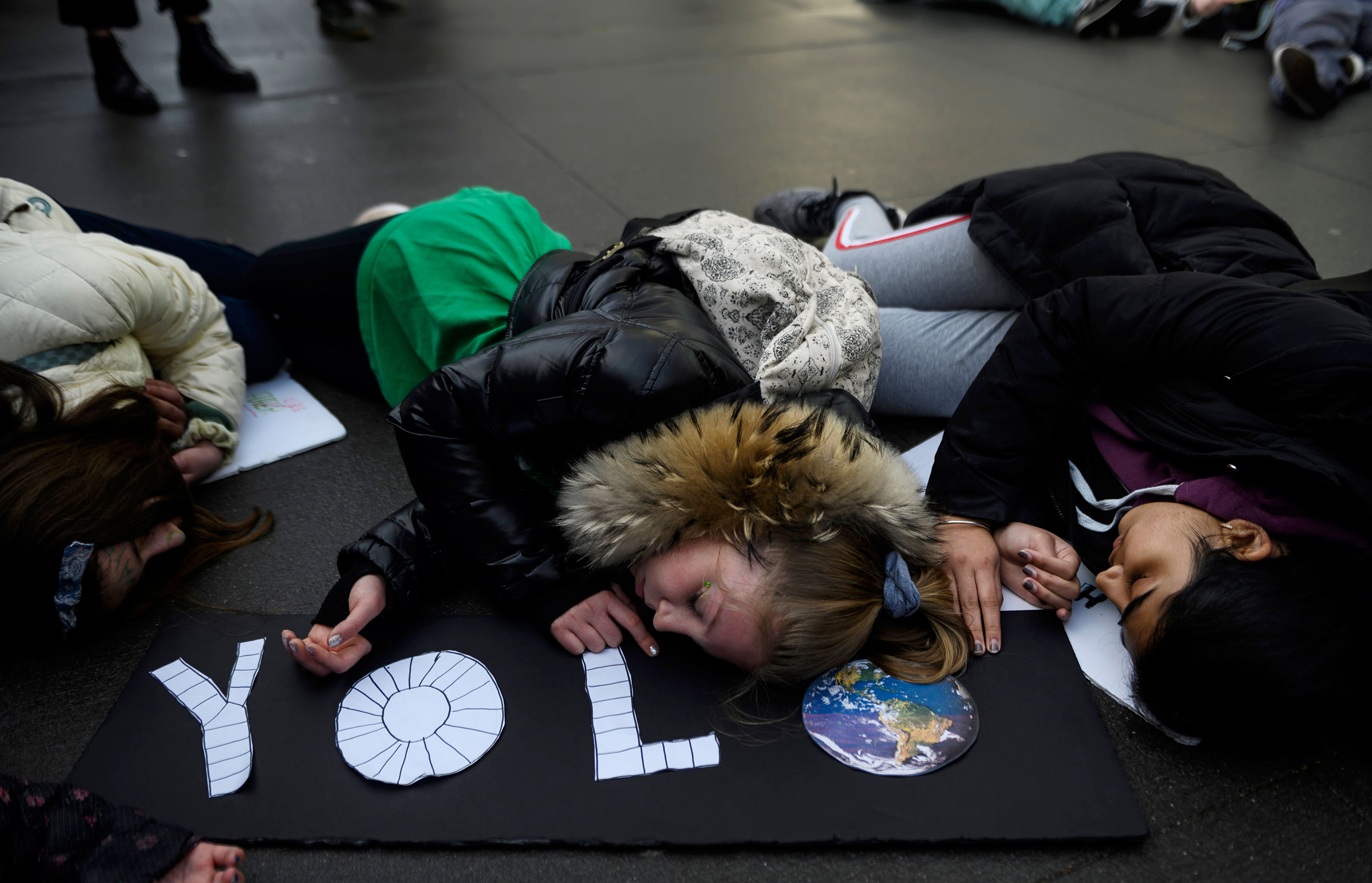 School children taking part on a die-in during a Youth Climate Strike in front of the New York Headquarters of the United Nations on March 15, 2019 in New York City. (Johannes Eisele—AFP/Getty Images)
