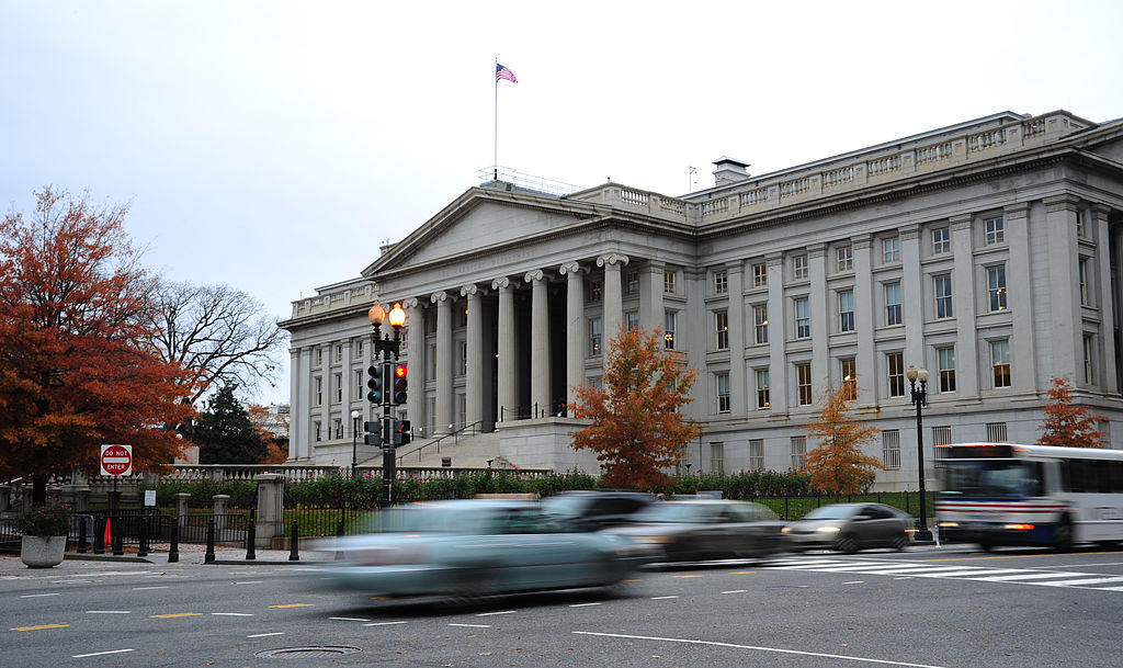Vehicles drive by the U.S. Treasury Building in Washington, DC on Nov. 15, 2011. On March 21, 2019 a section of the Treasury yield curve turned negative for the first time since the crisis of 2008 signaling a possible recession ahead. (Karen Bleier—AFP/Getty Images)