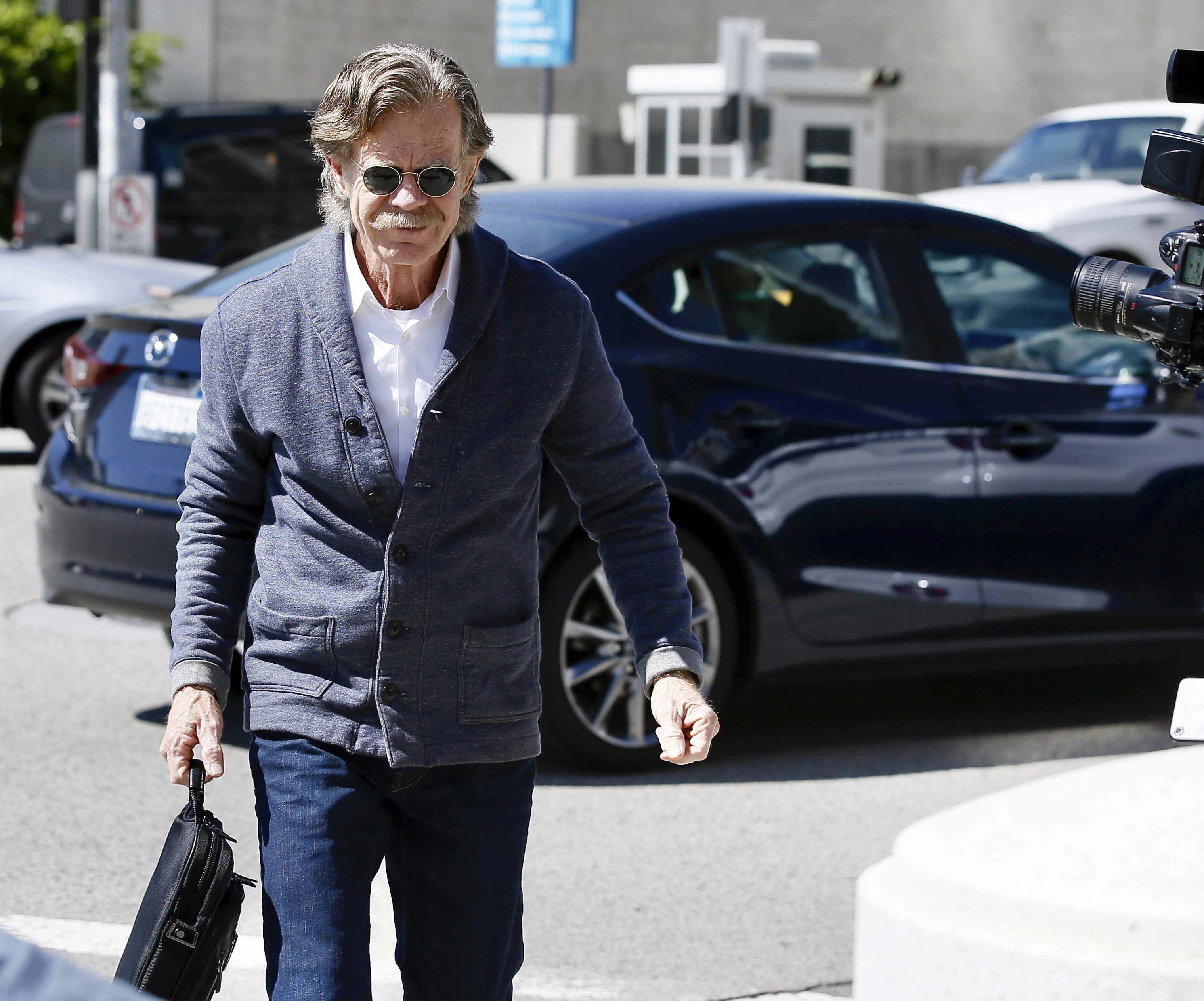 Actor William H. Macy arrives at the federal courthouse in Los Angeles, on Tuesday, March 12, 2019. Fifty people, including Macy's wife, actress Felicity Huffman and actress Lori Loughlin, were charged Tuesday in a scheme in which wealthy parents allegedly bribed college coaches and other insiders to get their children into some of the nation's most elite schools. Macy was not charged; authorities did not say why. (AP Photo/Alex Gallardo) (Alex Gallardo—AP)