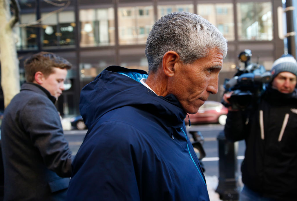 William "Rick" Singer leaves the John Joseph Moakley United States Courthouse in Boston on March 12, 2019. Fifty people have been arrested nationwide in what authorities are calling the largest college admissions scam ever, including 33 parents and a California businessman who allegedly collected $25 million in bribes to get students into some of the natiions top colleges, federal prosecutors in Boston said. Singer, 58, described by Boston U.S. Attorney Andrew E. Lelling as the central defendant in the scheme, allegedly collected the bribes. (Jessica Rinaldi—Boston Globe/Getty Images)