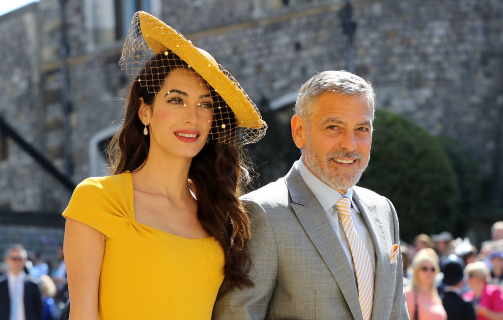 Amal Clooney and US actor George Clooney arrive for the wedding ceremony of Britain's Prince Harry, Duke of Sussex and US actress Meghan Markle at St George's Chapel, Windsor Castle, in Windsor, on May 19, 2018. (Gareth Fuller—AFP/Getty Images)