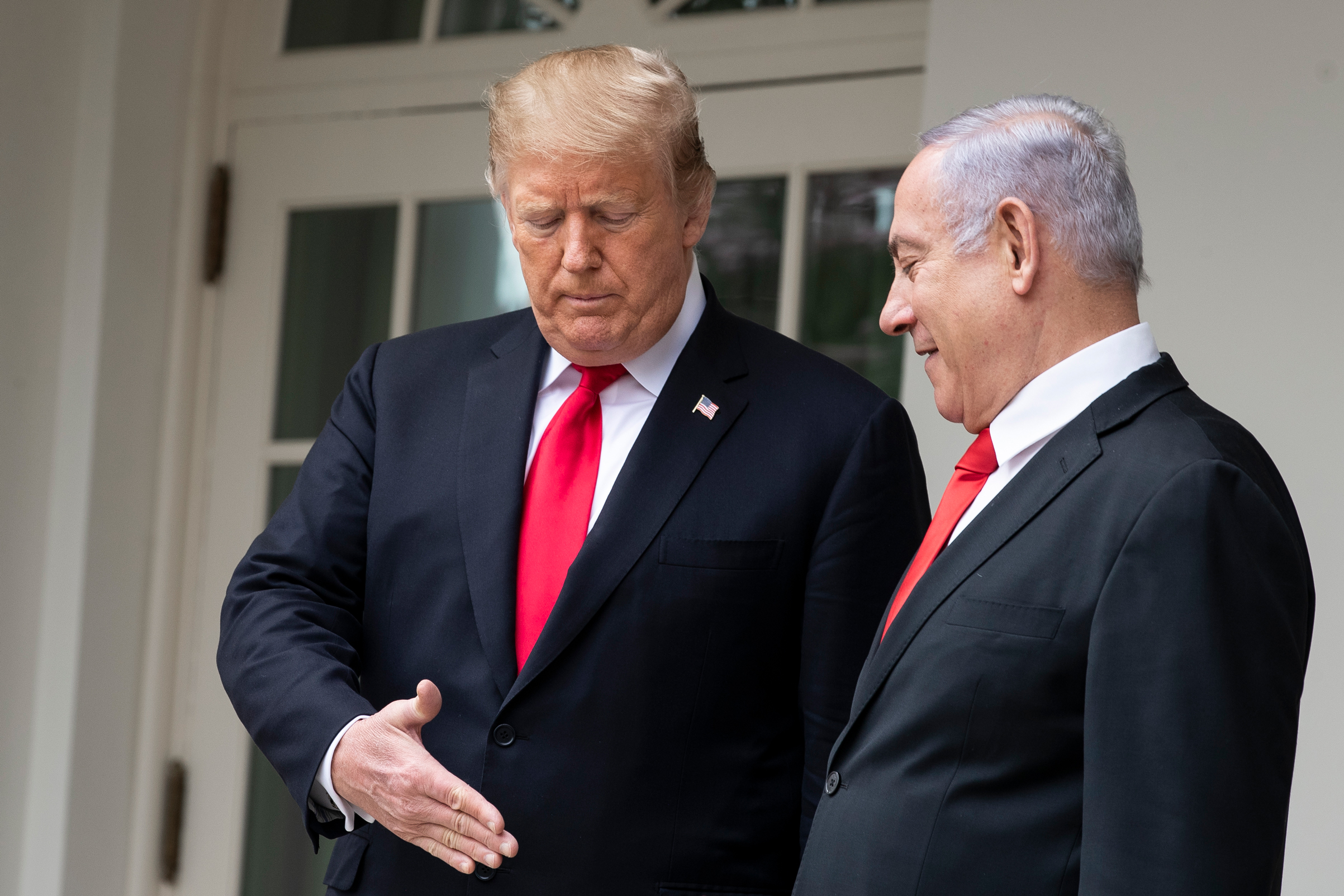 U.S. President Donald Trump and Prime Minister of Israel Benjamin Netanyahu prepare to shake hands prior to a meeting at the White House on March 25, 2019, in Washington, D.C. (Drew Angerer—Getty Images)
