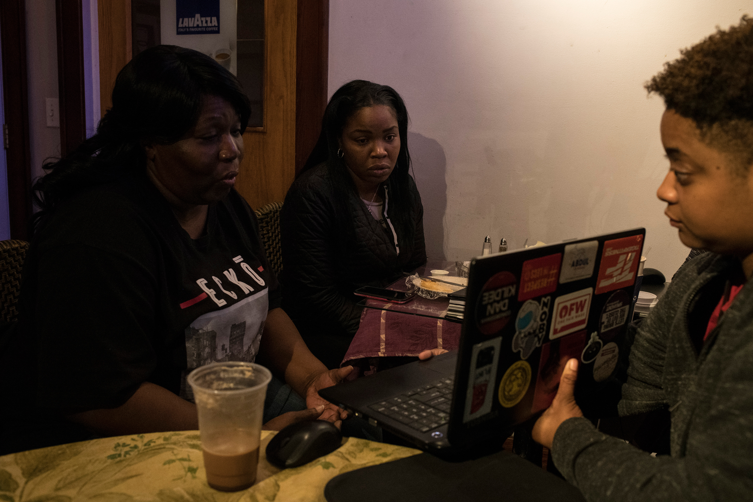Hawk joins a conference call with a non-profit alongside fellow Flint residents to discuss the needs of the city. (Brittany Greeson for TIME)