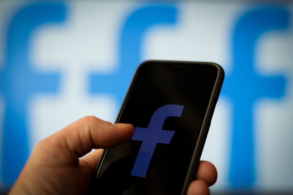 The Facebook logo is seen on an Apple iPhone in this photo illustration in Warsaw, Poland on April 25, 2019. (Jaap Arriens—NurPhoto/Getty Images) (Jaap Arriens—NurPhoto/Getty Images)