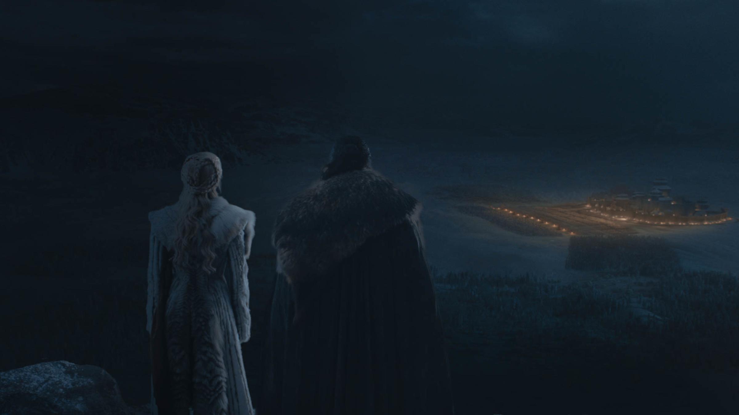 Emilia Clarke as Daenerys Targaryen and Kit Harington as Jon Snow view the Battle of Winterfell