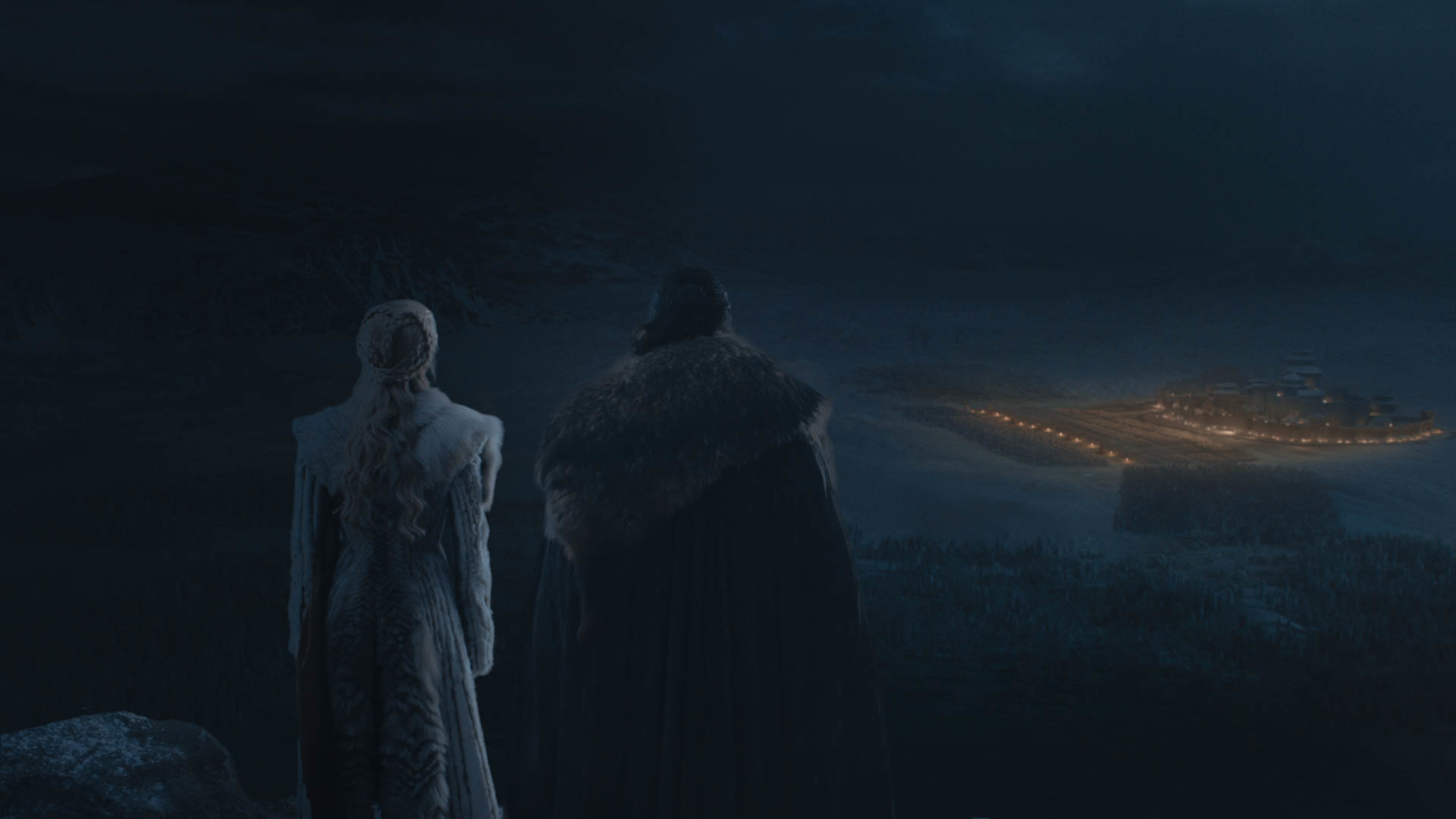 Emilia Clarke as Daenerys Targaryen and Kit Harington as Jon Snow look onto the season 8 episode 3 battle from afar. (Courtesy of HBO)
