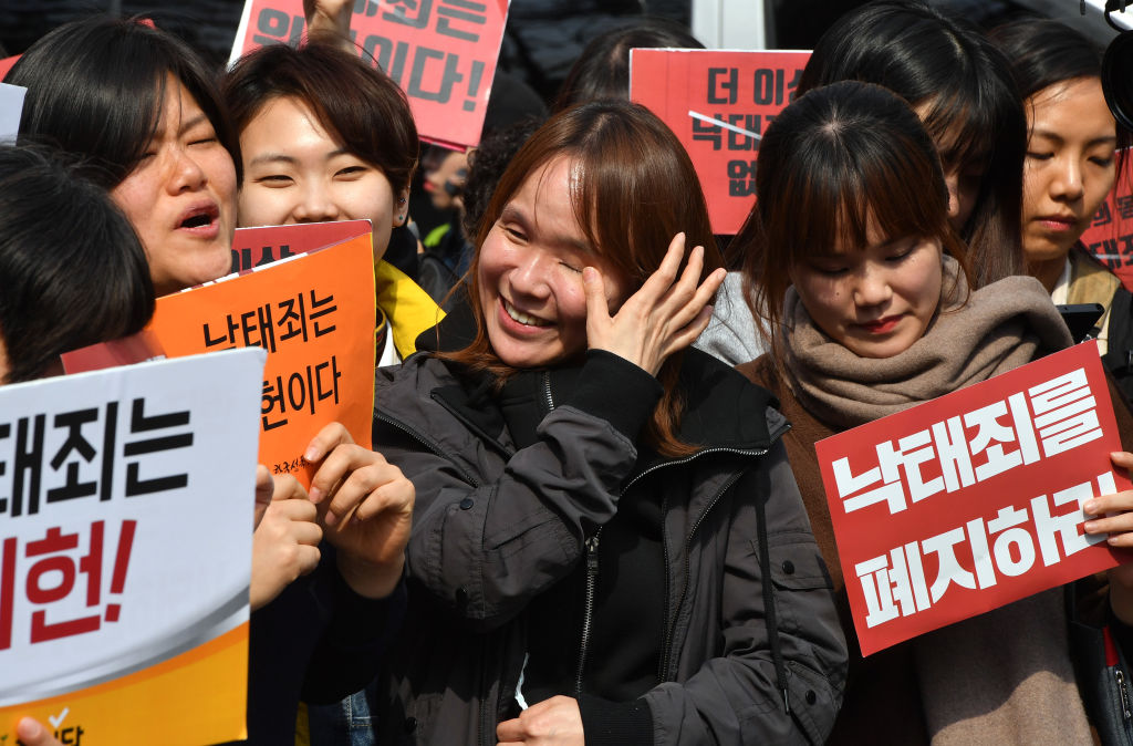 South Korean women react to legal ruling overturning a decades long ban on abortion