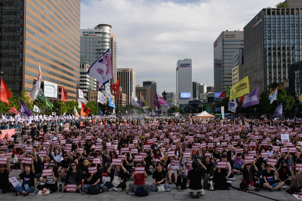 Protesters hold placards reading 'Abolish punishment for abortion' as they protest South Korean abortion laws in Gwanghwamun plaza in Seoul on July 7, 2018. (Ed Jones—AFP/Getty Images)