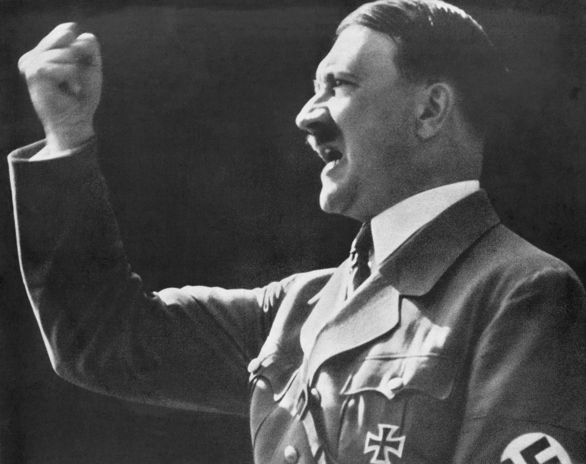Adolf Hitler raises a defiant, clenched fist during a speech. (Bettmann/Getty Images)