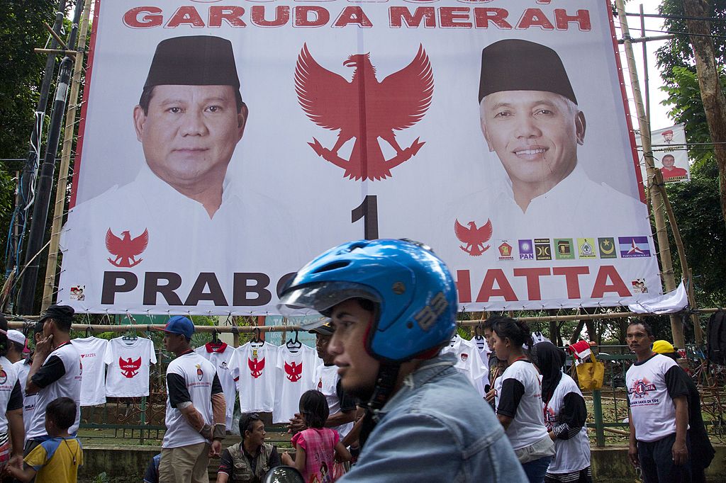 A motorcyclist rides past a large election poster for Indonesian Presidential candidate Prabowo Subianto in Jakarta, Indonesia on July 5, 2014. (Ed Wray&mdash;Getty Images)