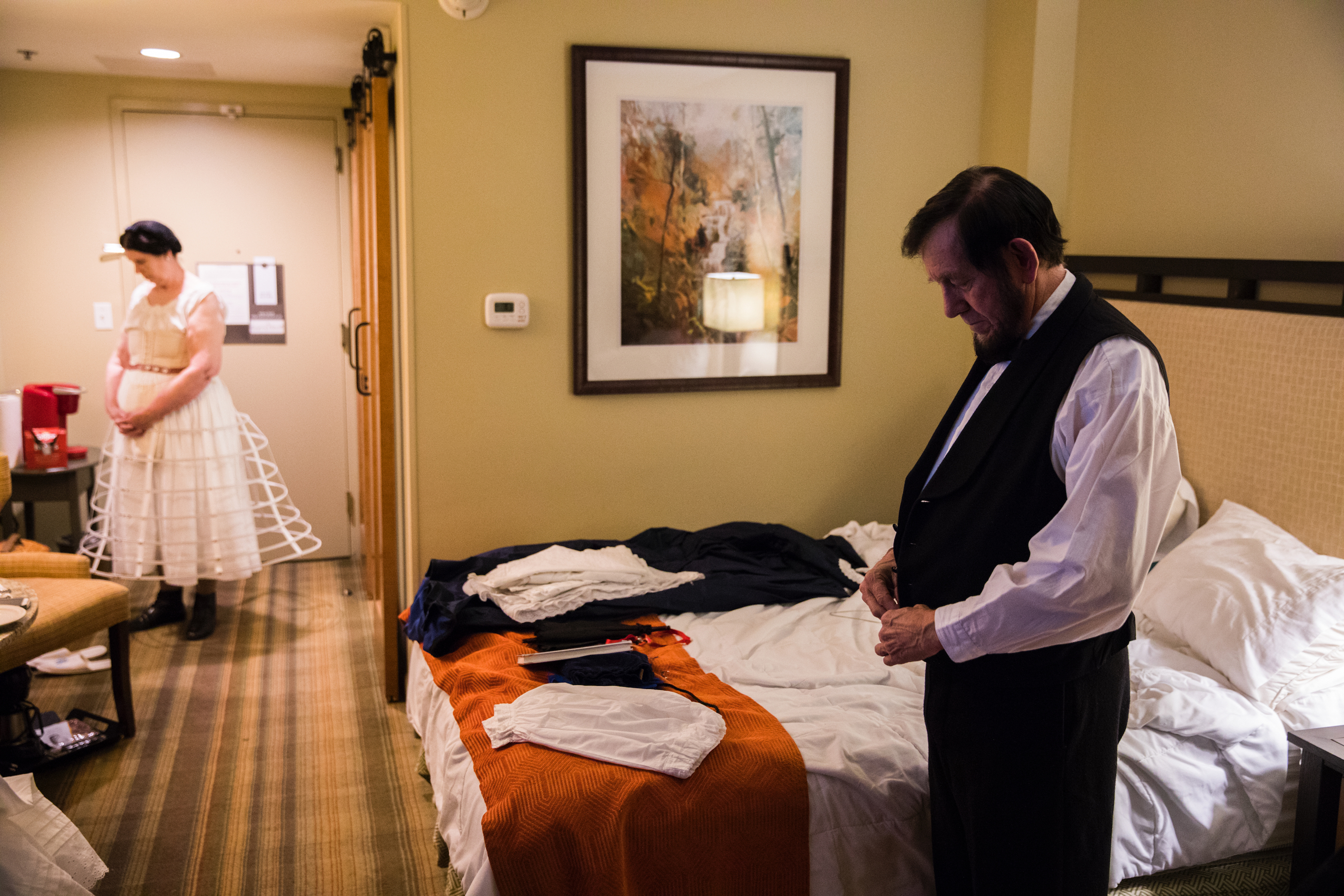 Tom and Sue Wright of Oak Ridge, Tennessee, who have been portraying Abe and Mary Lincoln for 10 years, get dressed in the pre-dawn hours at the Amicalola Lodge in Dawsonville on April 13. (Benjamin Norman for TIME)