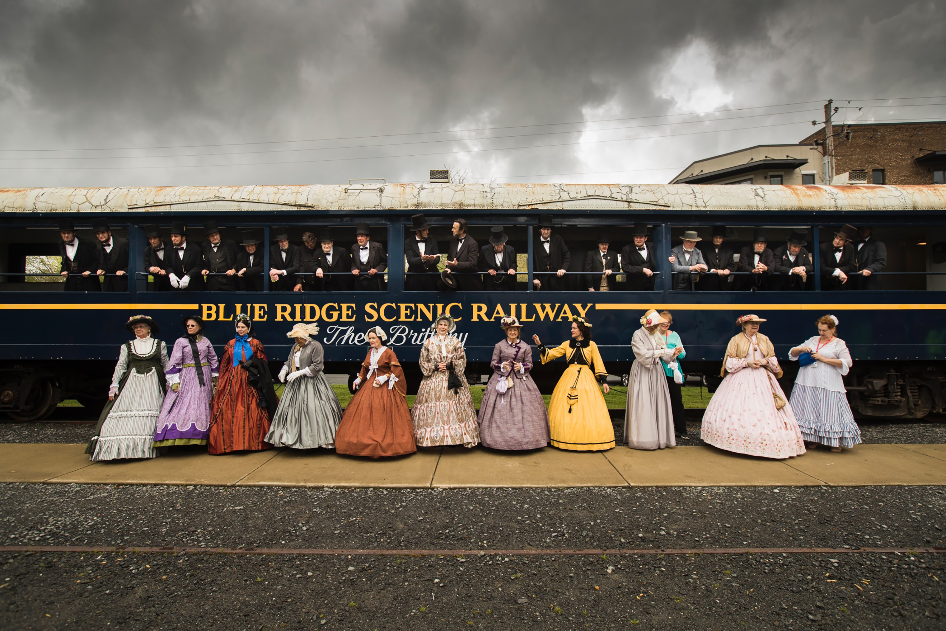 The Lincoln presenters group prepares to pose for a portrait in front of the railway in Blue Ridge, Georgia. They traveled there to take the scenic historic train ride to McCaysville, Ga., for lunch and shopping on April 12. (Benjamin Norman for TIME)