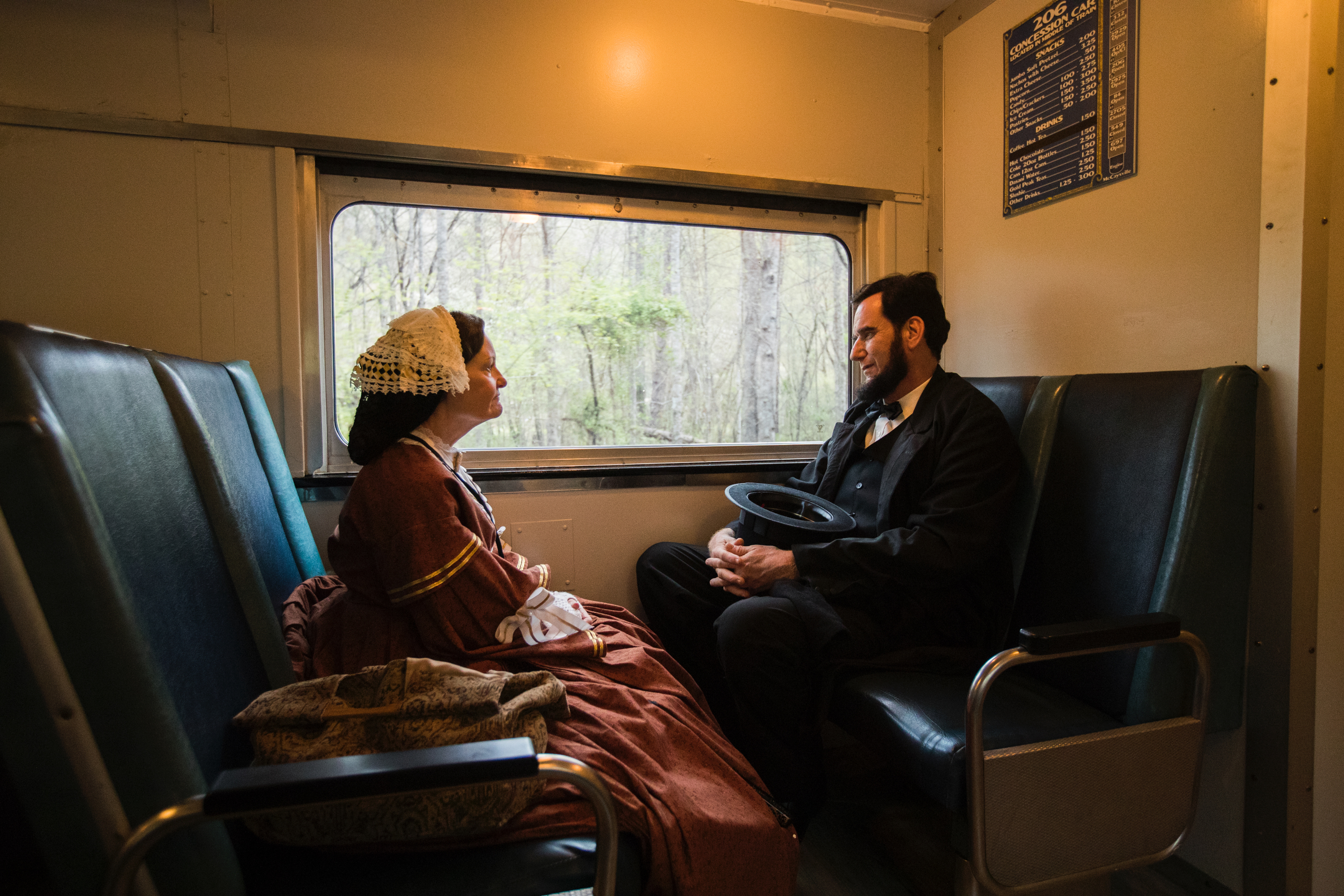 Members of the Lincoln Presenters conference take the scenic and historic train from Blue Ridge to McCaysville on April 12. Here, Teena Baldrige, 67, of Springboro, Ohio, chats with James Mitchell, 54, from Hope, Kan. (Benjamin Norman for TIME)