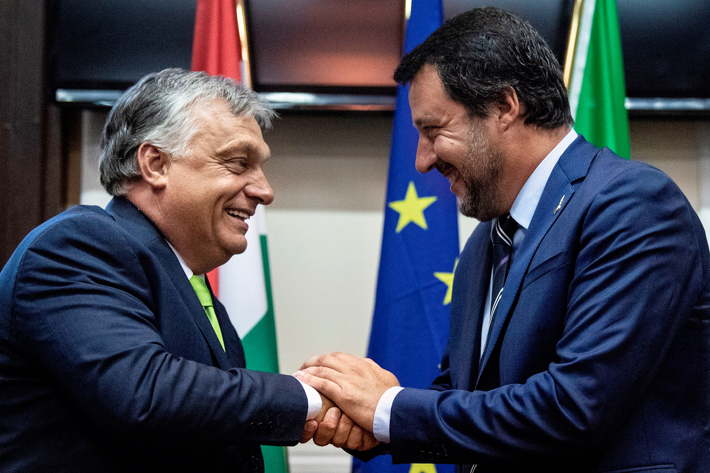 Italy’s Salvini, right, greets Hungary’s Orban in Milan (Marco Bertorello—AFP/Getty Images)
