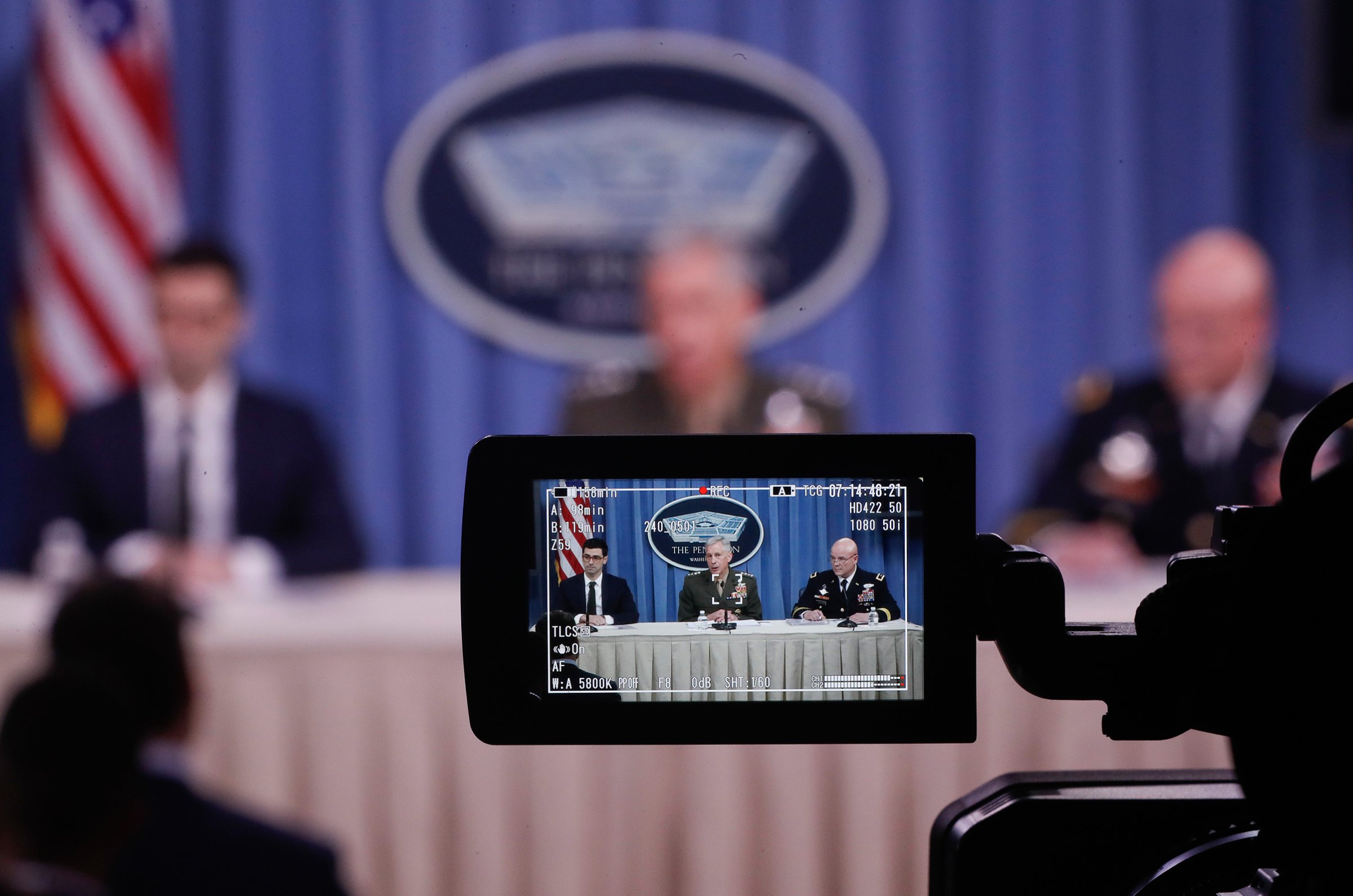 From left, Assistant Secretary of Defense for International Security Affairs Robert S. Karem, Marine Gen. Thomas D. Waldhauser and Army Maj. Gen. Roger L. Cloutier are seen through a television camera viewfinder while briefing members of the media at the Pentagon, May 10, 2018.